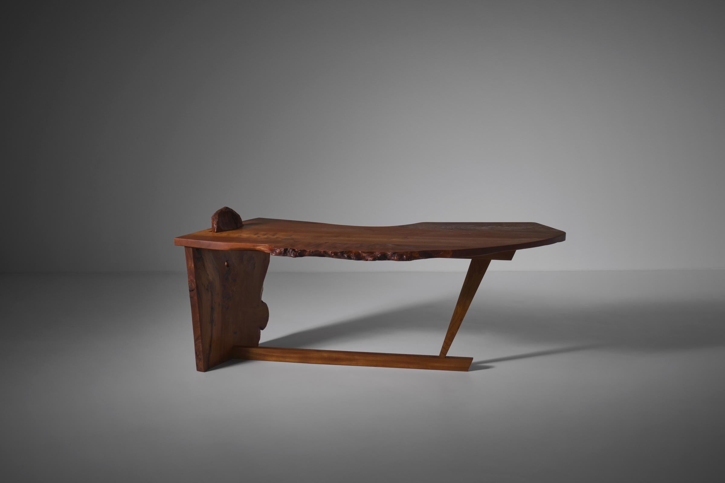 Exceptional free form shaped desk, France 1970s. Made from beautiful French Elm wood with an incredible wood grain and a nice deep warm color. The top is composed of three slabs in an interesting free form, with characteristic living edges. The main