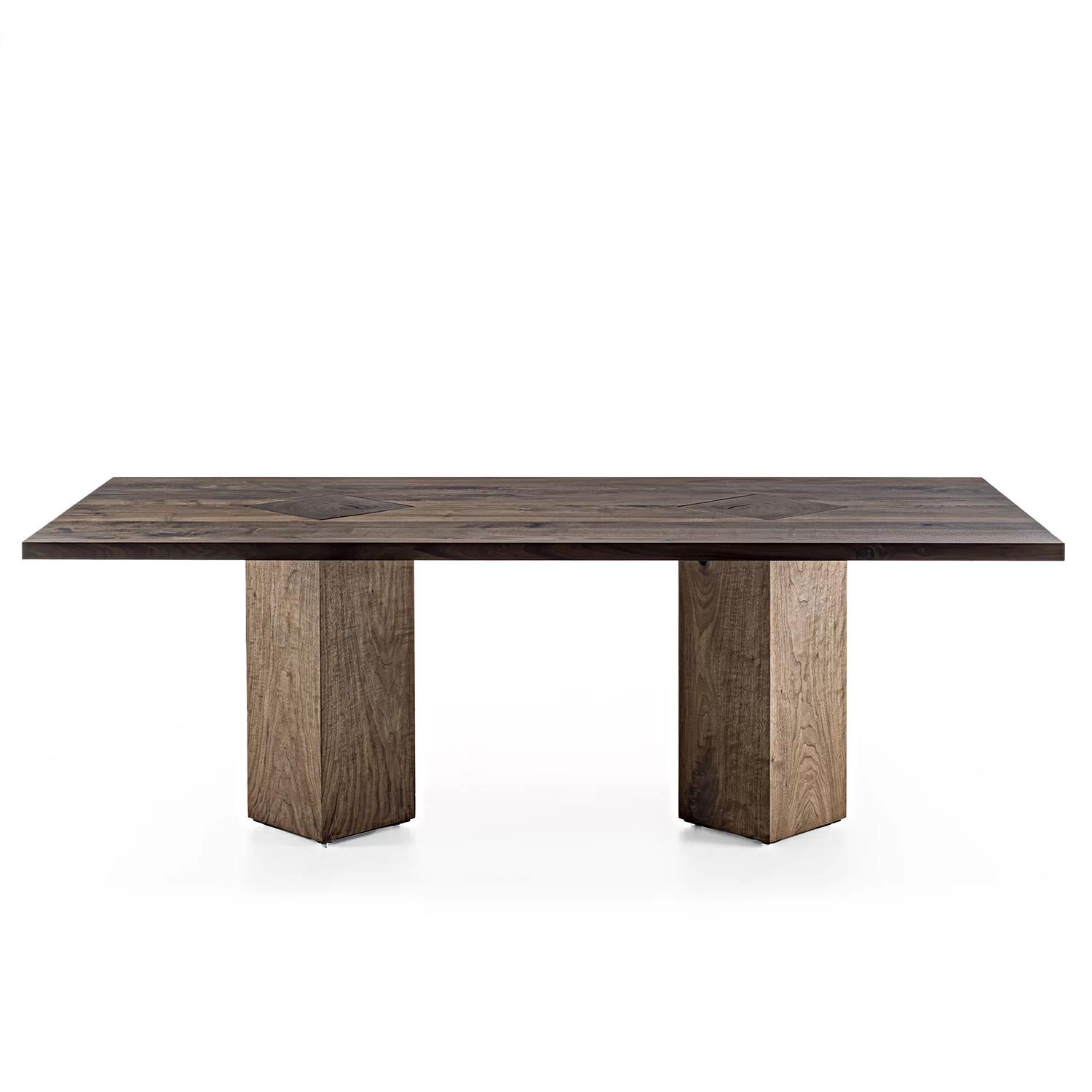 Dining Table Elma with all structure in solid walnut, table top made
with walnut glued slats and with 45° angles feet made from walnut 
tree trunks.
Also available on request in solid oak wood.
Also available on request in:
L240xD100xH75,5, price: