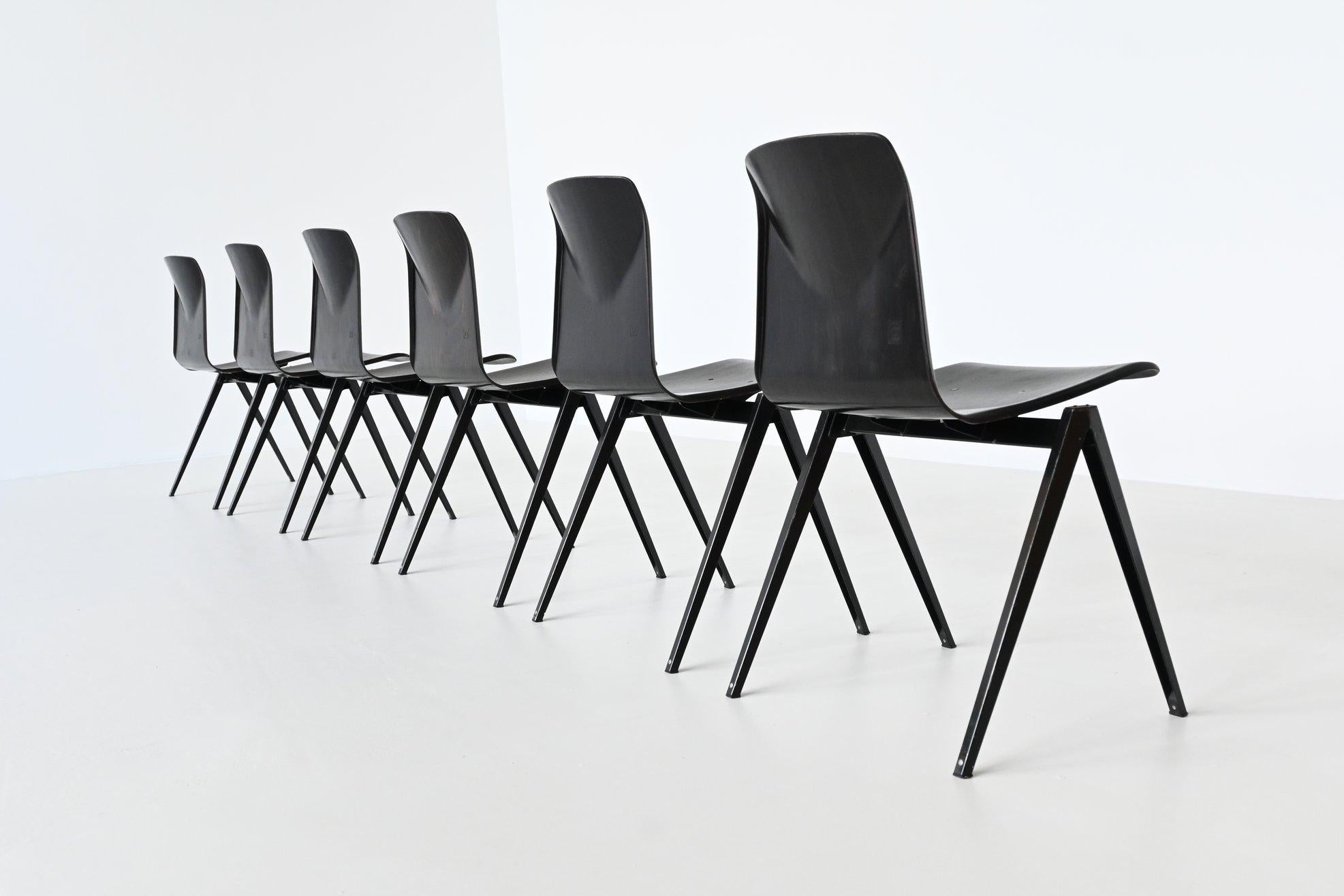 Large lot of 150 stacking chairs model S22 designed by Elmar Flototto and manufactured by Pagholz, Germany, 1970. These chairs have black v-shaped metal frames and dark brown pressed wood seats. They have a nice patina from several years of usage,