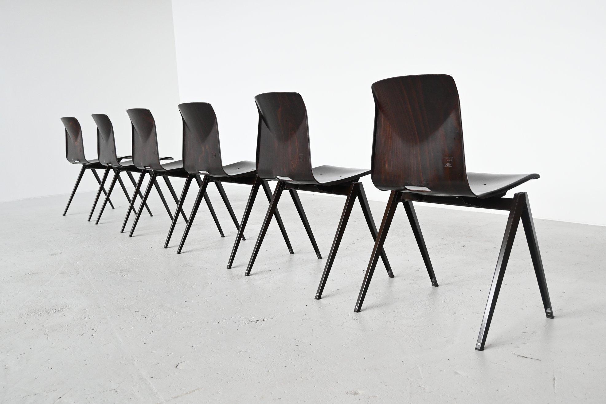 Large lot of 30 stacking chairs model S22 designed by Elmar Flototto and manufactured by Pagholz, Germany, 1970. These chairs have dark brown V-shaped metal frames and dark brown pressed wood seats. They have a nice patina from several years of