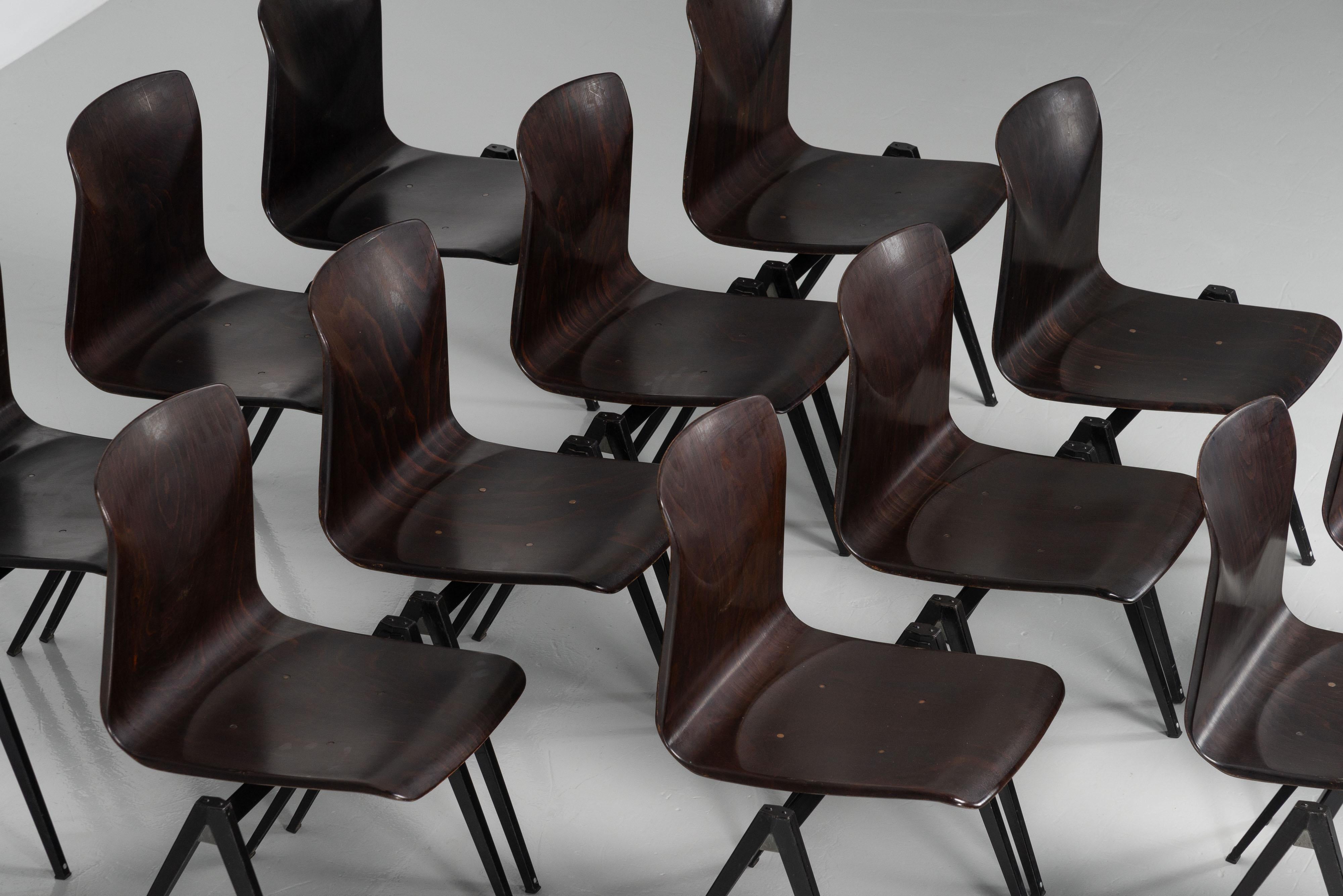 Nice large set of S22 stacking chairs designed by Elmar Flototto and manufactured by Pagholz in Germany in 1970. They're very well designed to be stacked on top of each other and interlocked next to each other. These chairs are designed really well