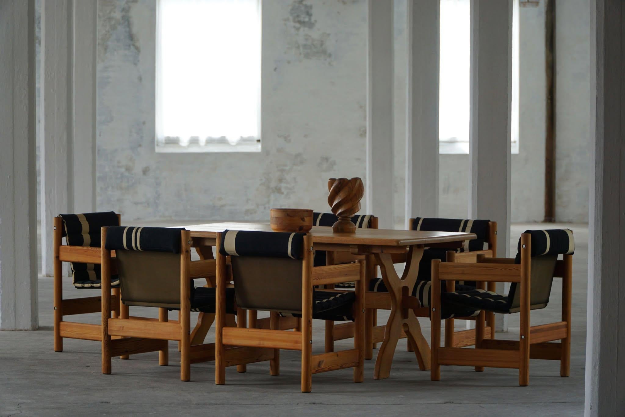 A striking set of six Danish Modern armchairs designed by Elmar Moltke Nielsen & Knud Friis in the 1960s. These sculptural chairs showcase solid pine frames with beautifully expressive wood grain, highlighting the natural character and craftsmanship