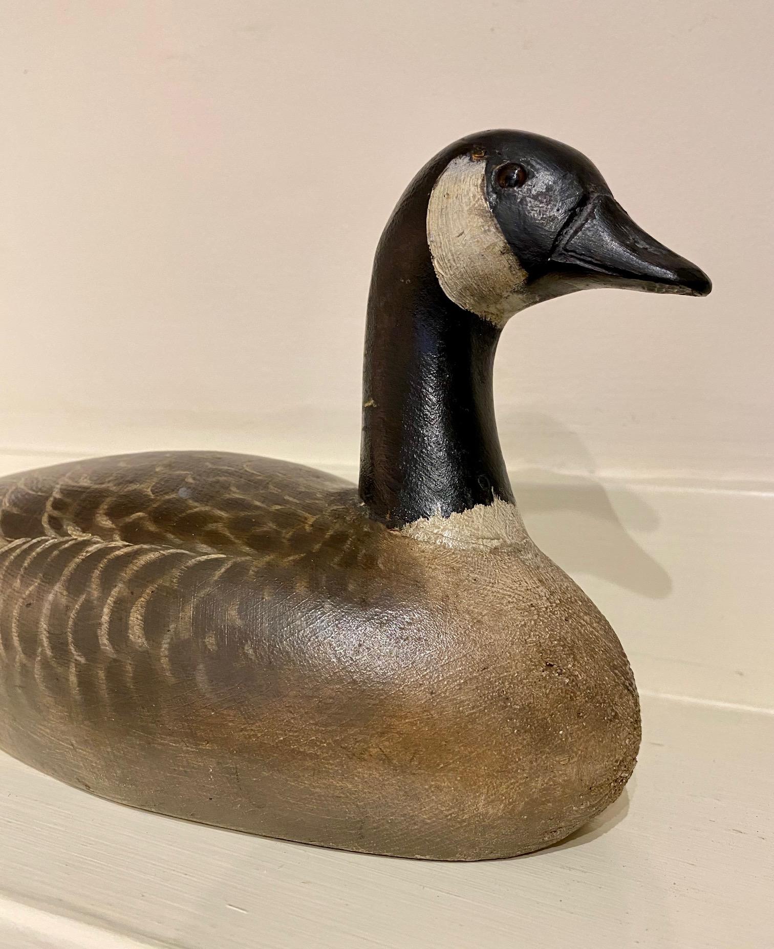 Antique Quarter Sized Canada Goose Decoy, by J.Elmer Crowell, East Harwich, MA (1862 - 1952), circa 1928 - 1943, a hand carved and painted diminutive Canada Goose goose decoy signed with Crowell's rectangular stamp on the bottom.

Strong original