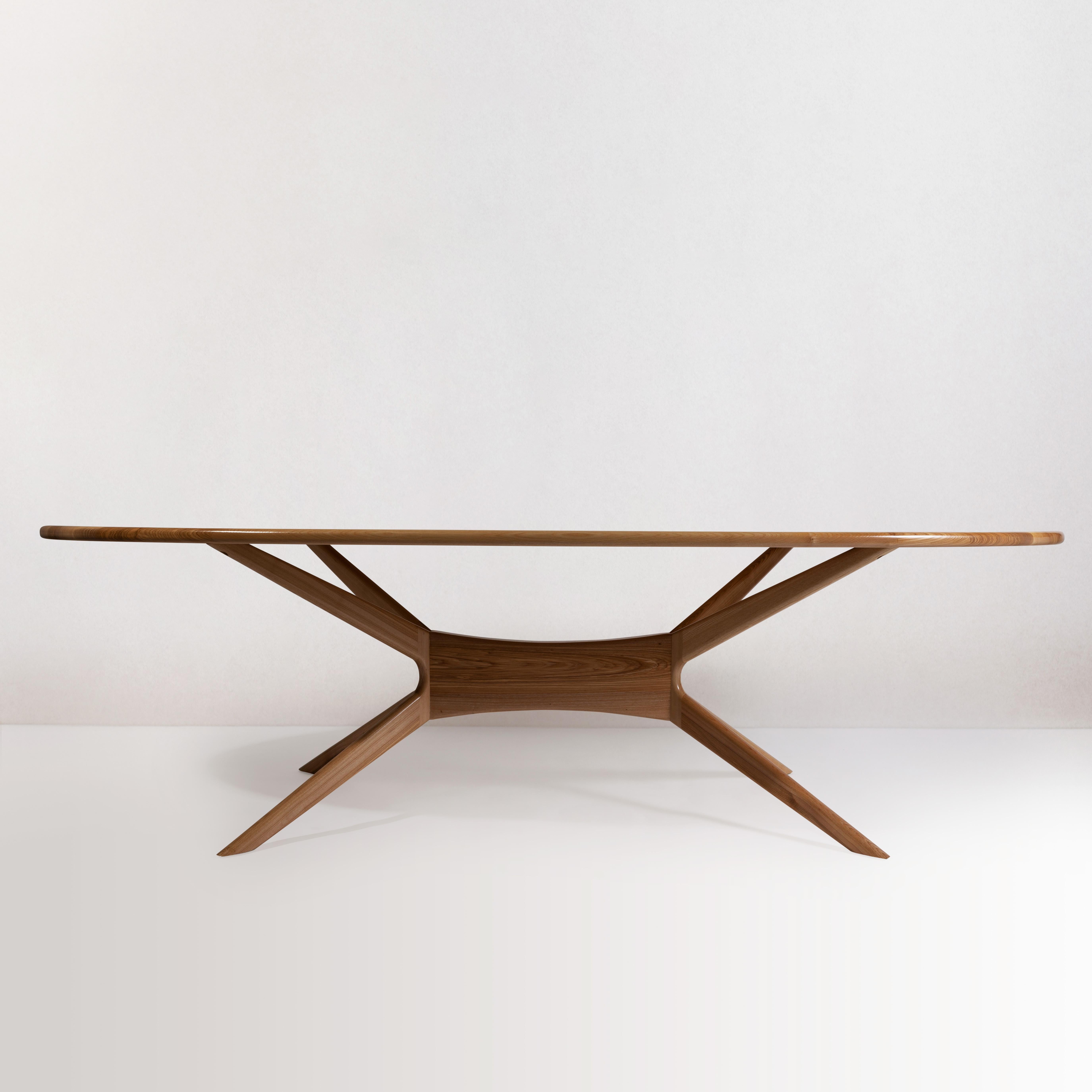 A modern style luxury dining room table, the Elmond Dining Room Table offers a unique design with a long oval style table that can comfortably sit eight people. A table that is perfect for meals and conversation that will last generation after