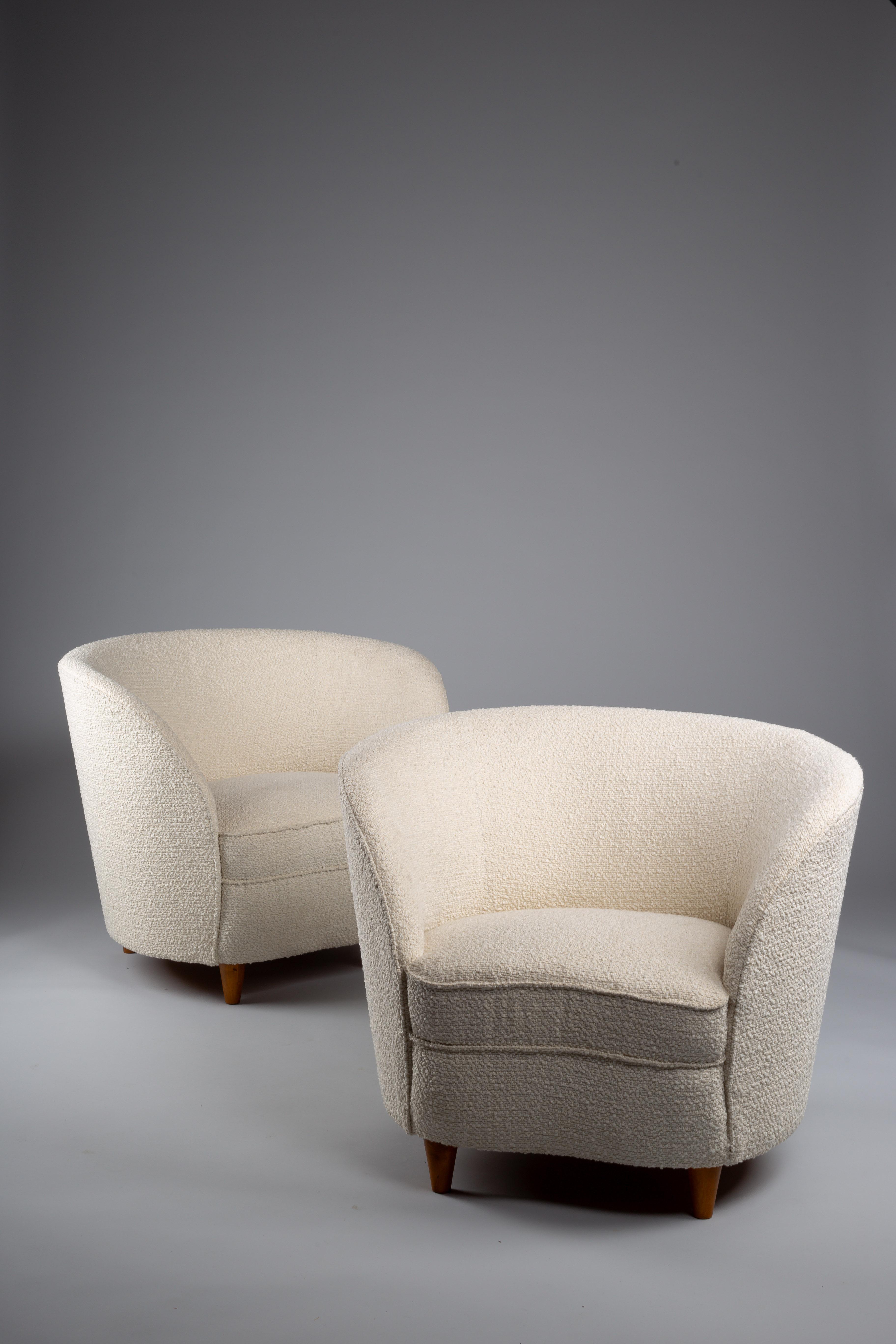 Experience timeless elegance with the Elna Kiljander pair of 1930's lounge chairs, newly upholstered to bring modernist charm into your home. Designed by the renowned woman architect and designer Kiljander, these chairs embody the essence of