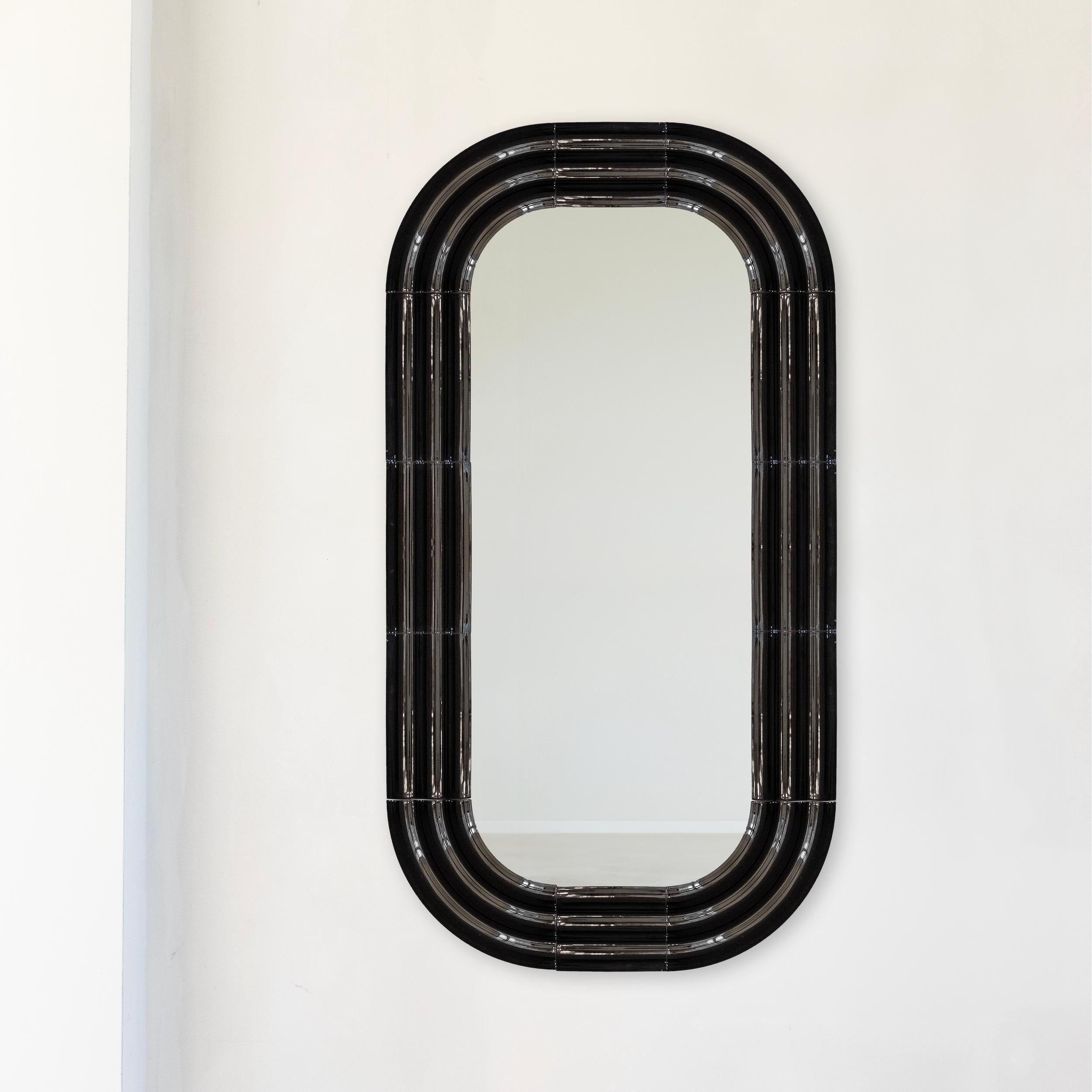 In the new mirrors collection, Pani Jurek explores ceramics and the reflective potential of mirror surfaces. Inspired by the ripple effect on water, the sculptural frames mimic the expanding circles that appear after a splash. The ceramic elements