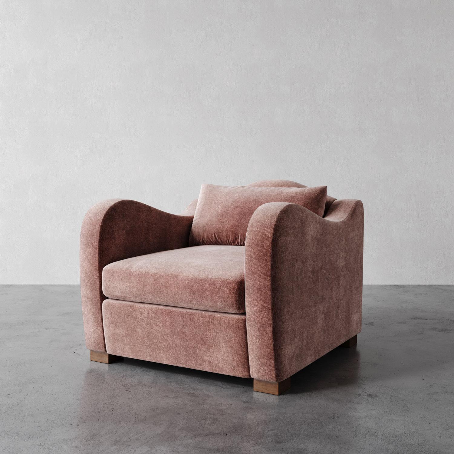 The Elodie Chair draws inspiration from the elegant curves of 1930s French design, channeling the works of Jean Royère, Pierre Chareau and Marc du Plantier. With its deep seat, soft back cushion, and swooping arms, it balances luxury and modernity,