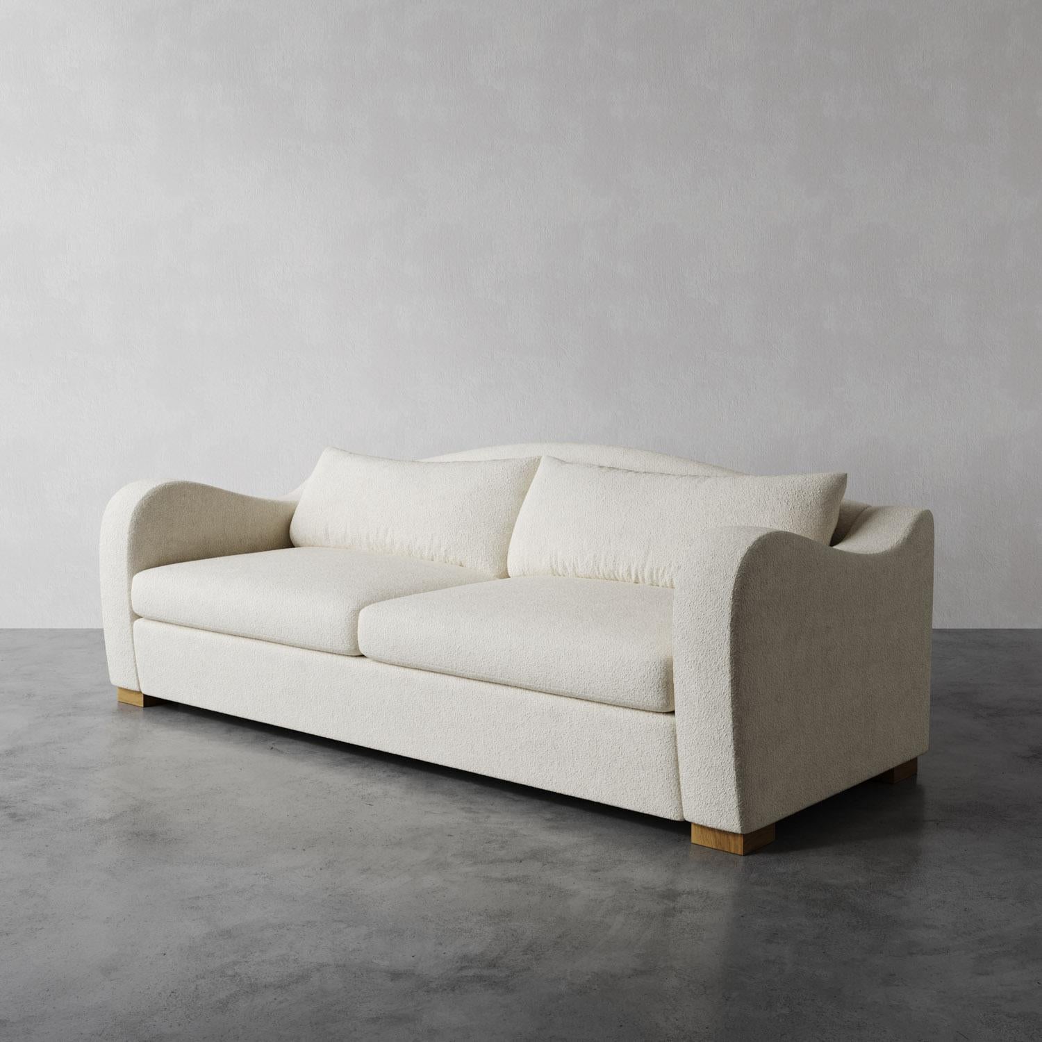 El Sofá Elodie se inspira en las elegantes curvas del diseño francés de los años 30, canalizando las obras de Jean Royère, Pierre Chareau y Marc du Plantier. Con su profundo asiento, suave cojín trasero y brazos en picado, equilibra lujo y