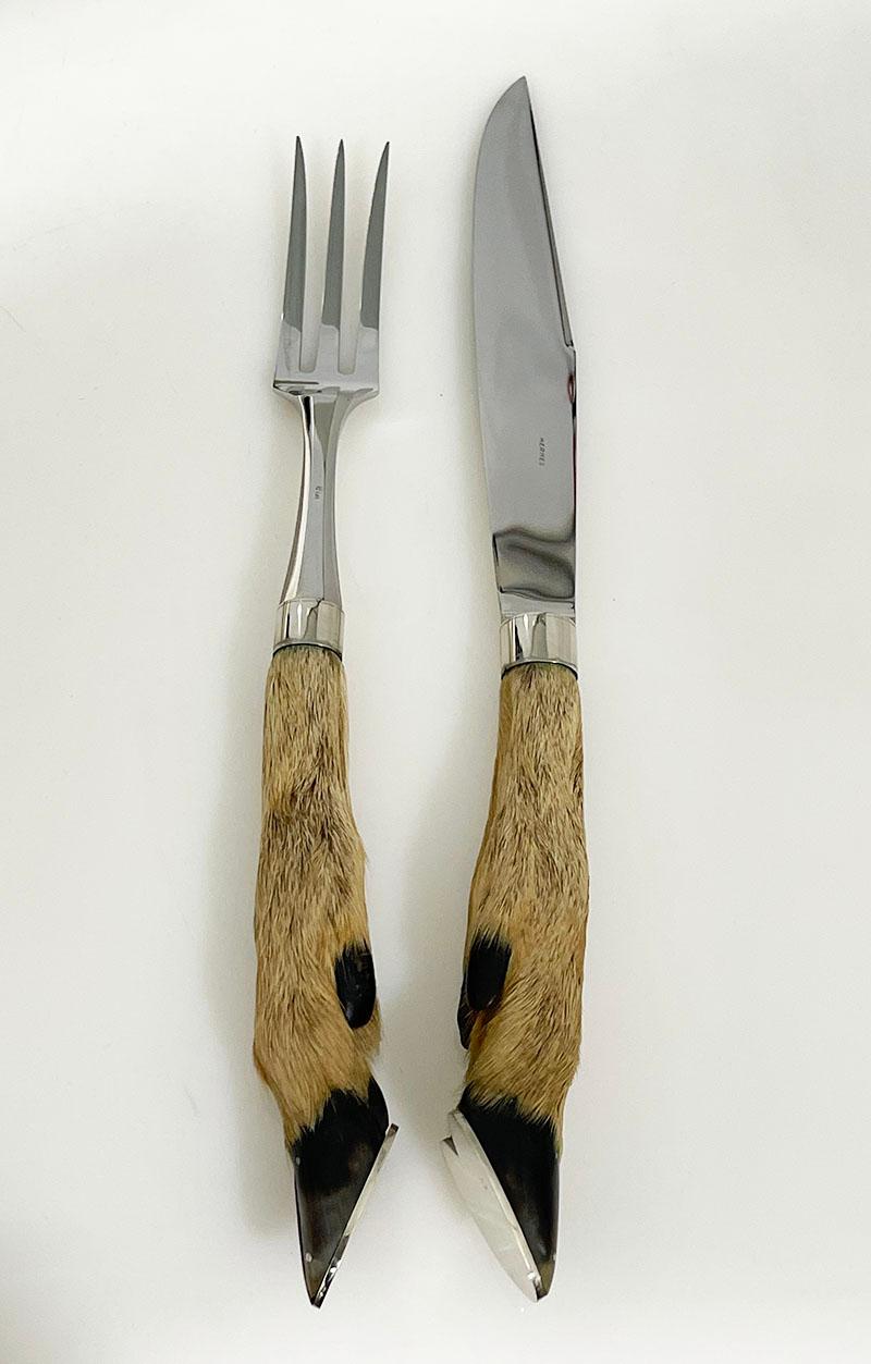 Eloi for Hermès French carving set

A French Charles Louis Eloi Pernet for Hermes Paris 
A Hermes set in the original box with a carving knife and fork made of deer's feet with a steel blade. Marked on the knife and fork 