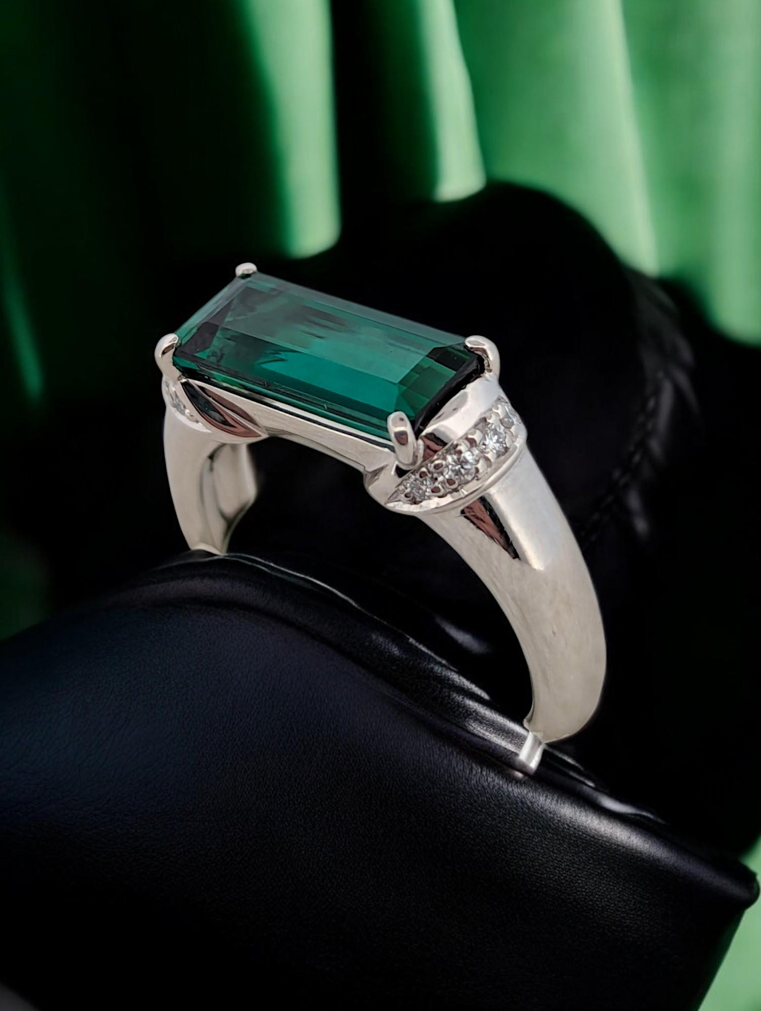 This stunning platinum ring features a captivating 2.93-carat tourmaline accented by 0.09-carat diamonds, creating a sophisticated and timeless design. A perfect choice for engagements, anniversaries, or a luxurious jewelry collection, this