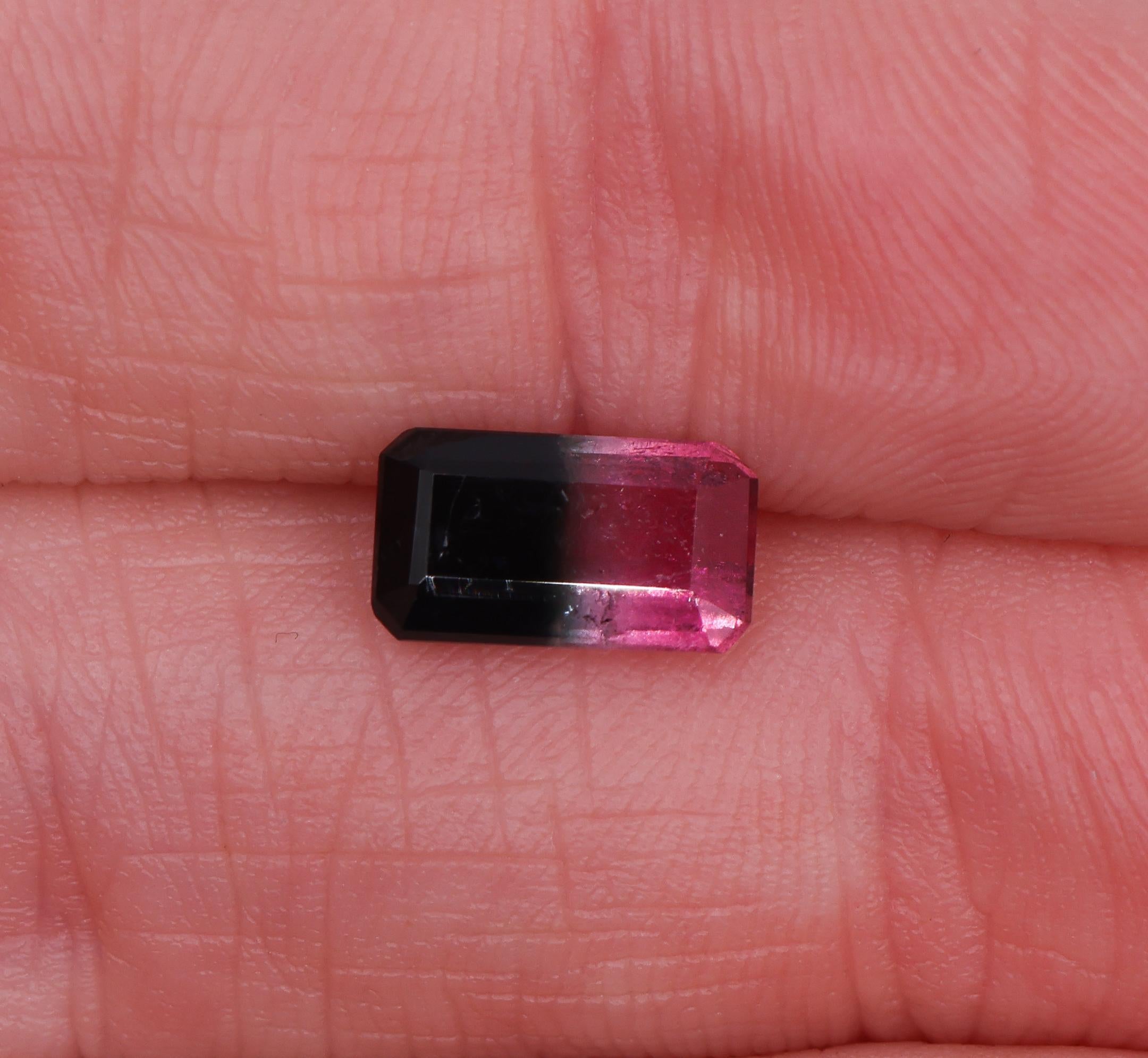 Presenting an elongated emerald cut 1.36 carat tourmaline gemstone! 

This gemstone exhibits a range of colours such as green, white and pink. It's elongated form makes it suitable for accent stones in rings, earrings or pendants, adding a touch of