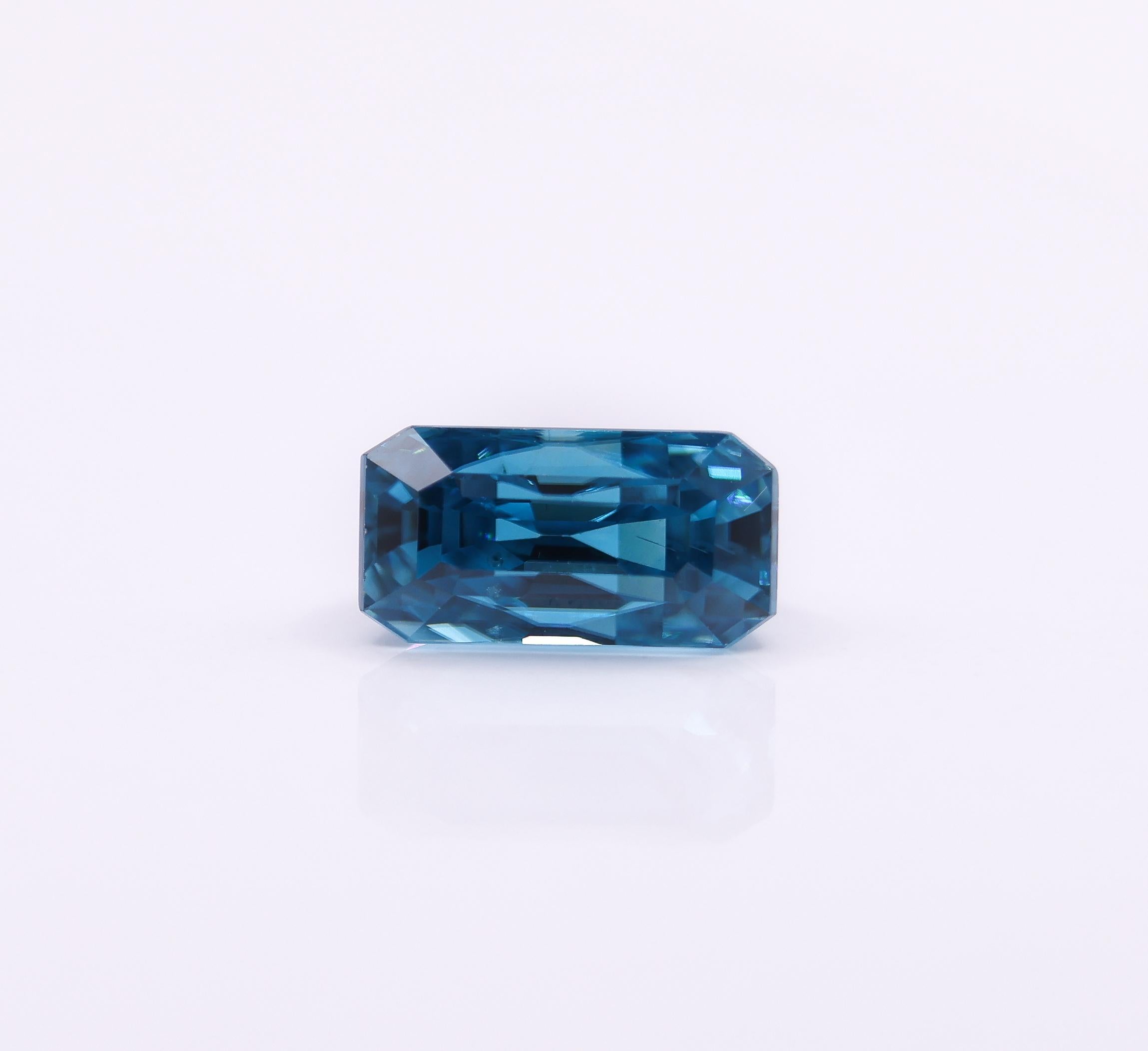 Emerald Cut Elongated 4.77 Carat Blue Zircon Gemstone  EM 11x6mm For Sale