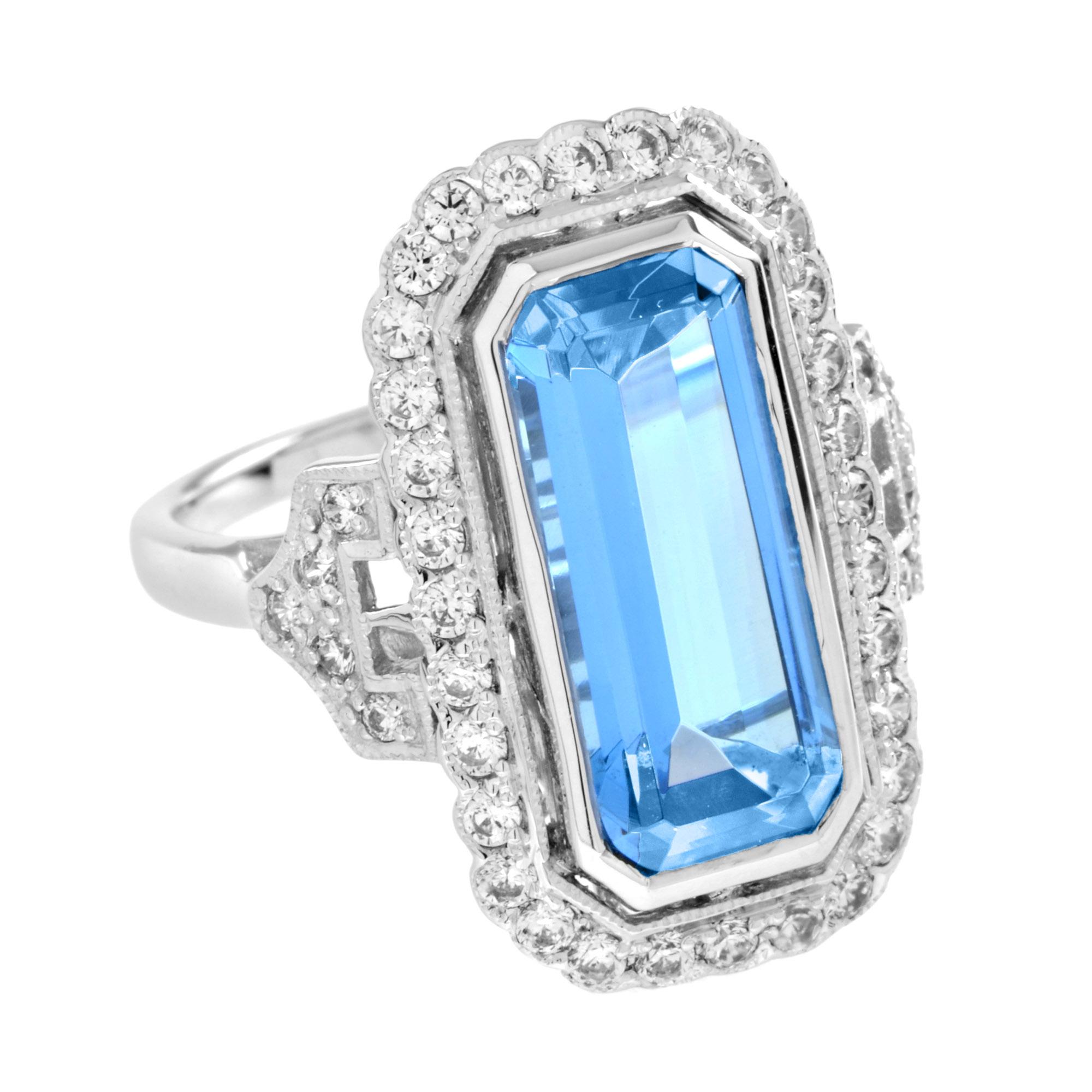 Drawing inspiration from the pattern of the bygone ear, this Art Deco inspired blue topaz ring. Glimmering round diamonds create a brilliant halo around the emerald-cut blue topaz. Additional diamond accents embellish the shoulder for extra shimmer.