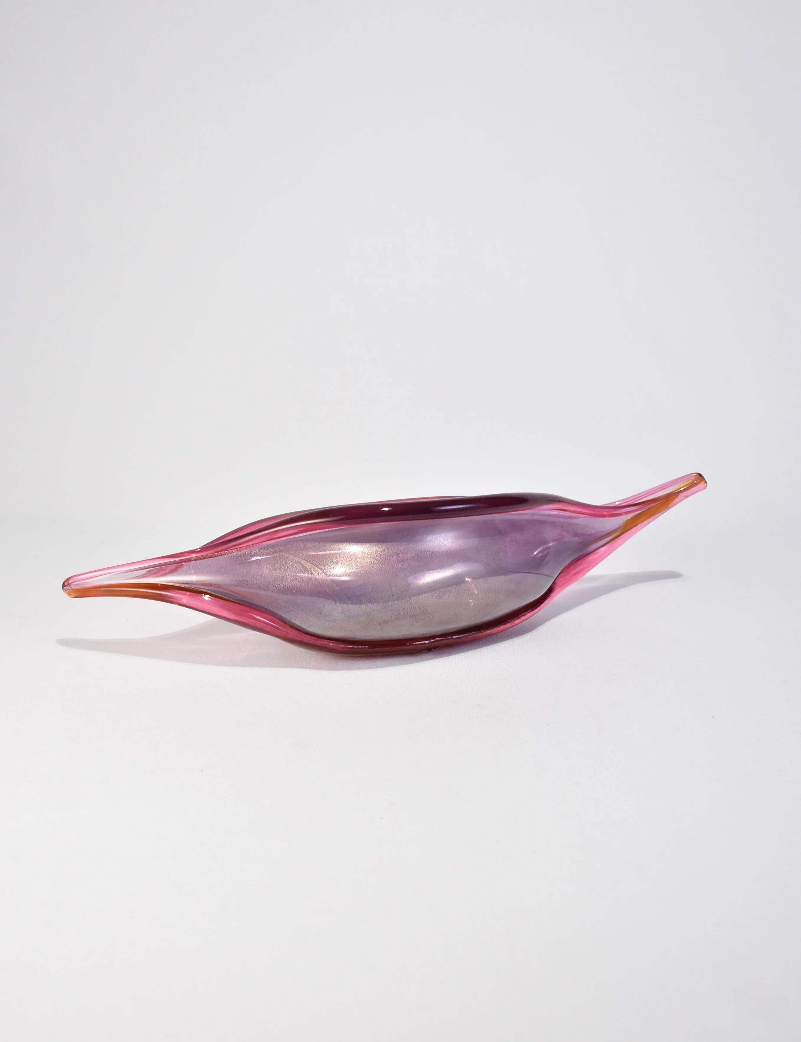 Beautiful pink blown glass bowl in an elongated shape with gold fleck detail. Signed on base.