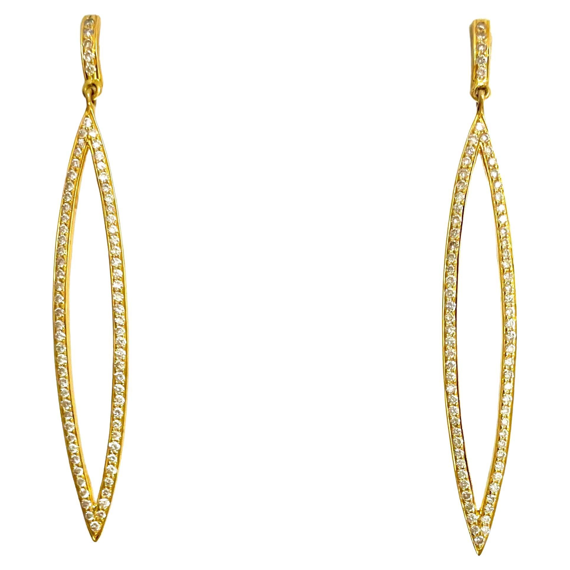 Description
These striking 18k yellow gold open marquise shape earrings with pave diamonds are the epitome of modern and classic style. 
Item # E3339

Materials and Weight
18k yellow gold
Pave diamonds 1.90cts
14k posts and jumbo backs

Dimensions