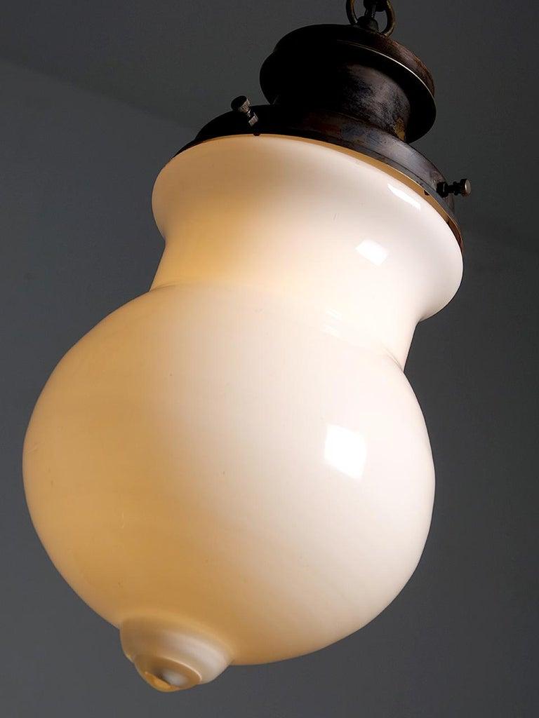 American Elongated Milk Glass Globe Pendent For Sale