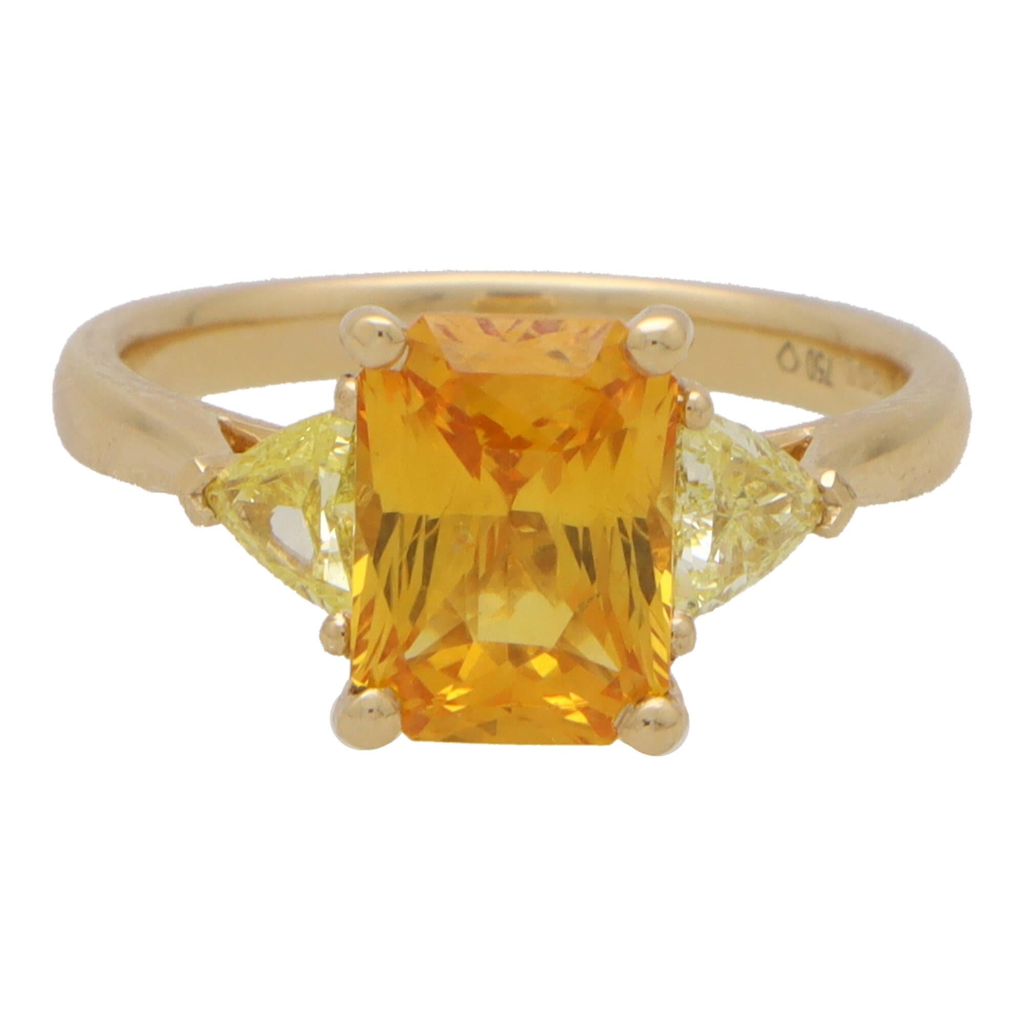 Mixed Cut Elongated Orange Sapphire and Yellow Diamond Three Stone in 18k Yellow Gold For Sale