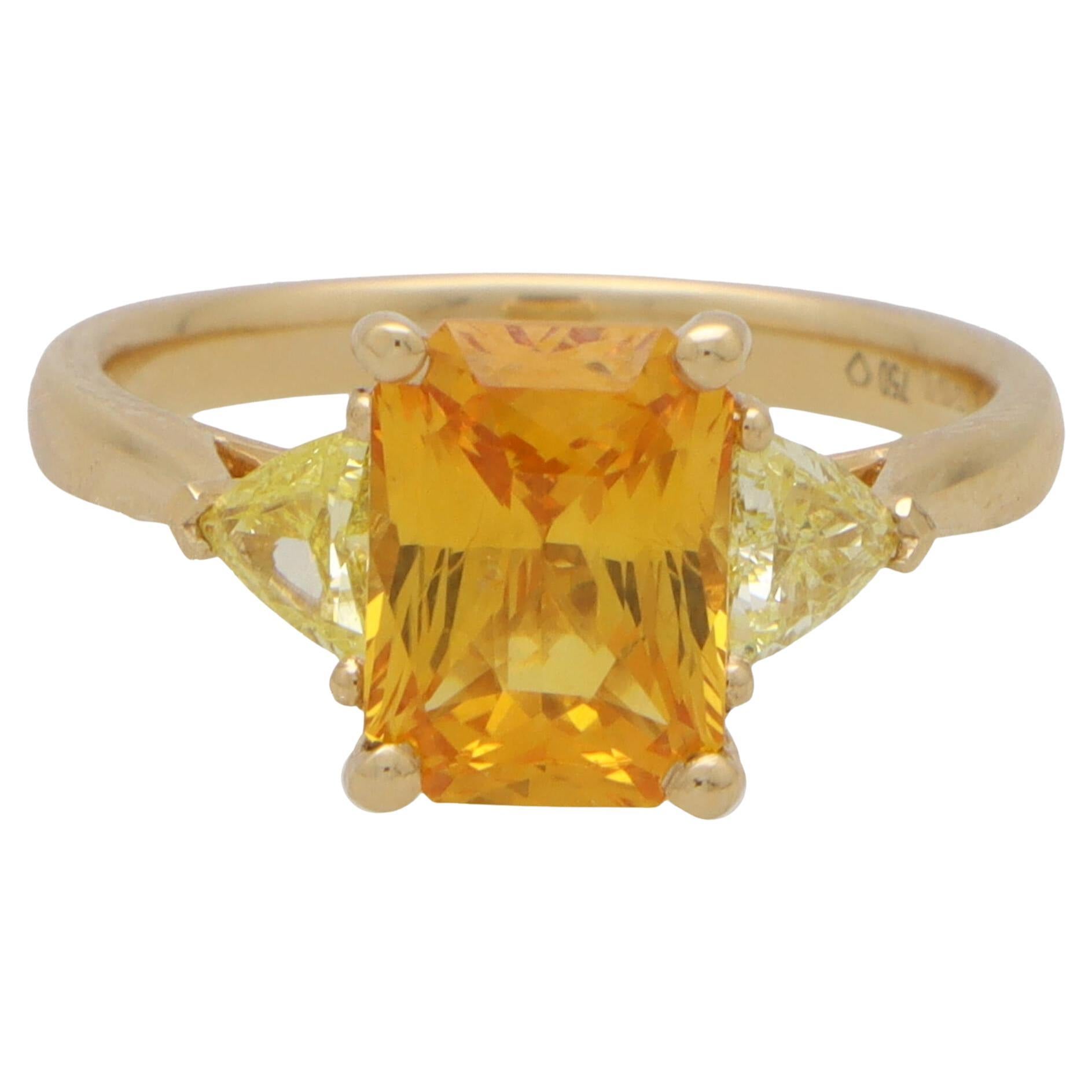 Elongated Orange Sapphire and Yellow Diamond Three Stone in 18k Yellow Gold For Sale
