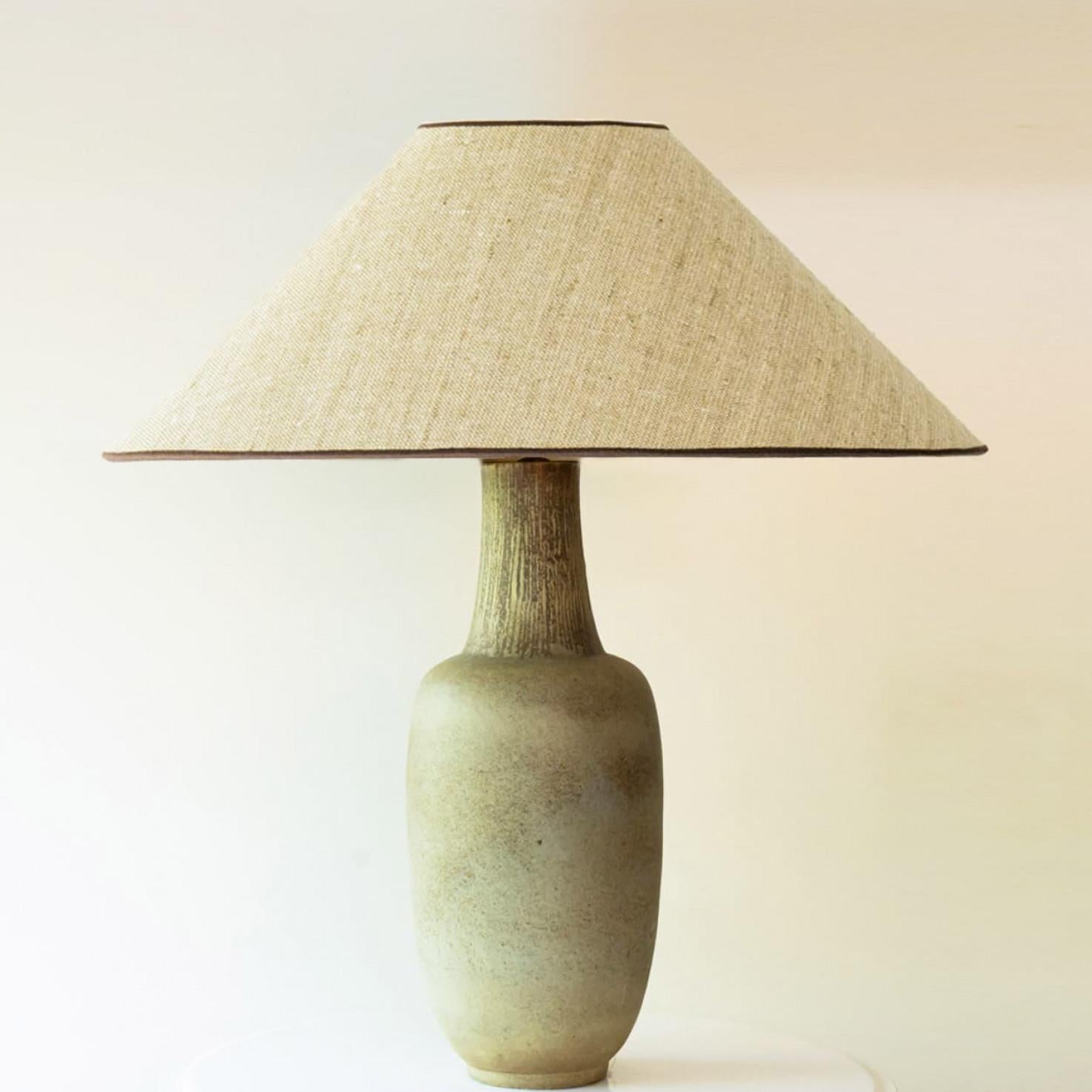Heavy quality ceramic floor lamp or XXL table Lamp,  1970s.

This lamp base brings refined elegance and rich visual appeal to any interior. With its beautiful shape, it offers a unique presence.

This elongated-ovoid form and  lime green with beige