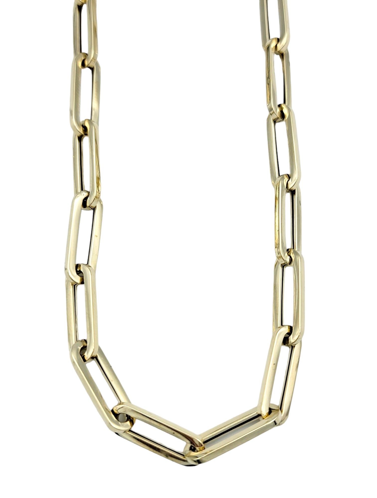 Elevate your style with our versatile paperclip link necklace crafted in luxurious 14K yellow gold. This sophisticated accessory seamlessly blends modern design with timeless elegance, creating a statement piece that effortlessly transitions from