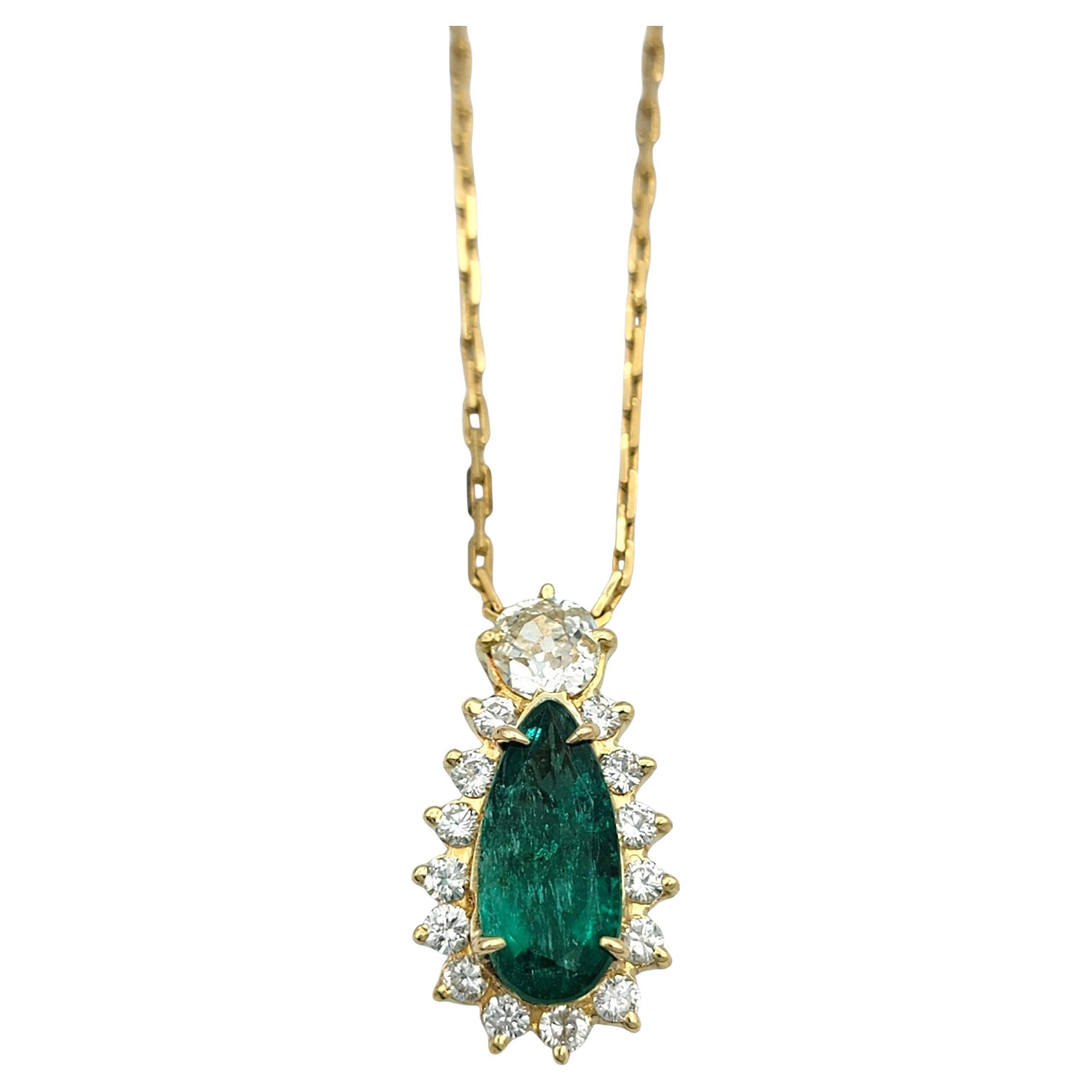 Elongated Pear Cut Emerald
Diamond Halo Pendant Necklace 18 Karat Yellow Gold