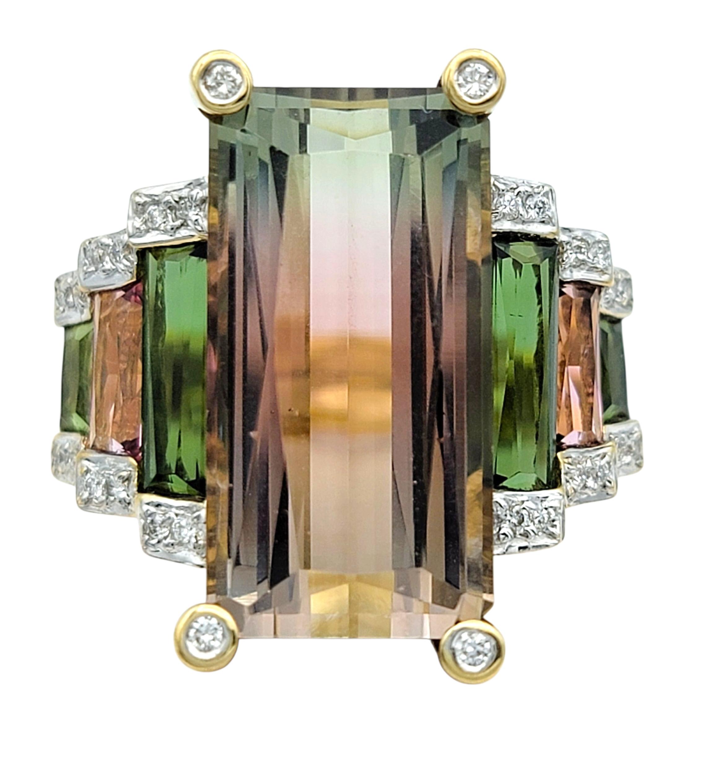 Ring Size: 8.75

This bold and artistic ring showcases a dramatic elongated rectangular cut pink and green bi-color tourmaline at the center. The gemstone's vertical gradient creates a captivating visual effect, transitioning from vibrant pink to
