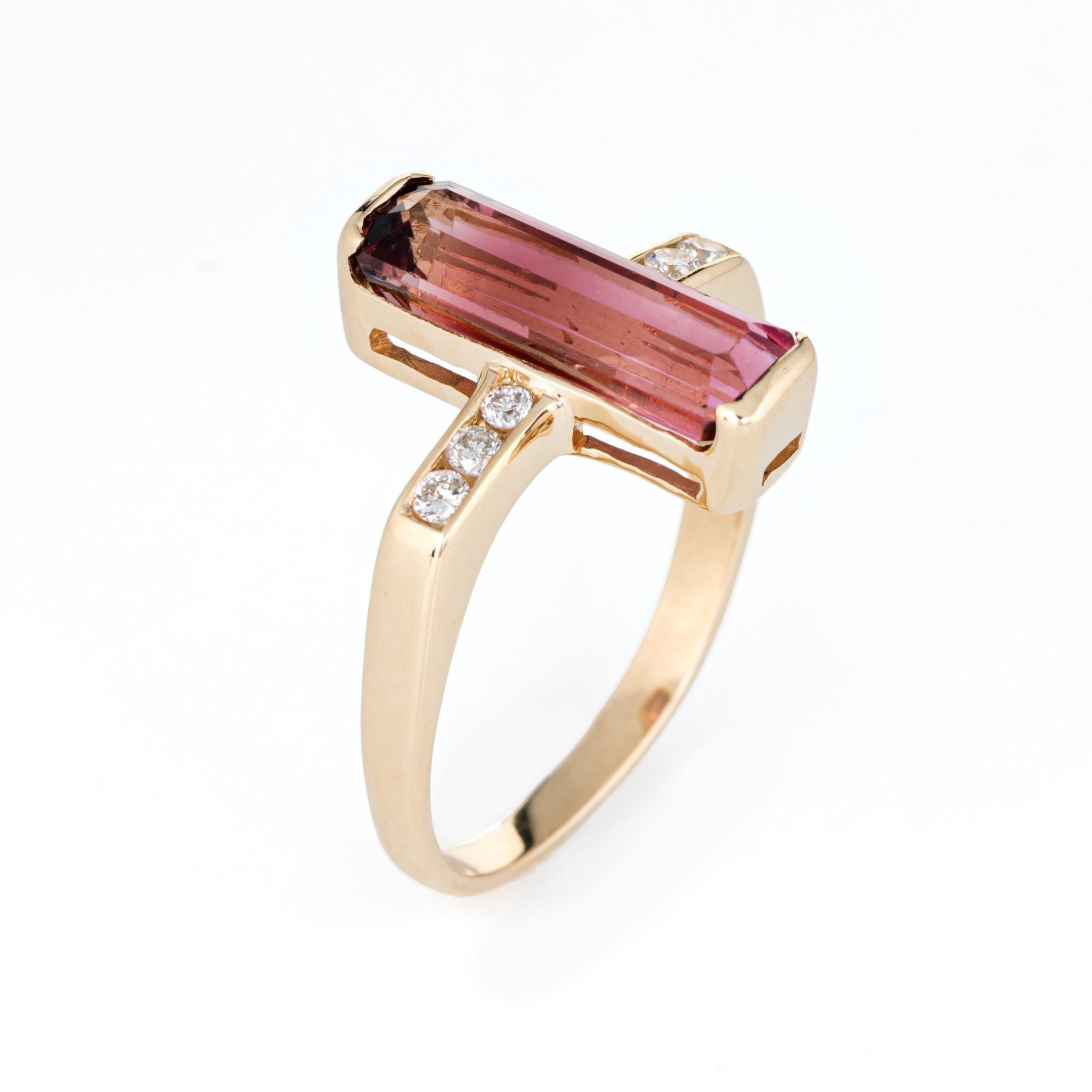 Stylish elongated pink tourmaline & diamond ring crafted in 18 karat yellow gold. 

Pink tourmaline measures 14mm x 5mm (estimated at 3 carats) accented with an estimated 0.12 carats of diamonds (estimated at H-I color and SI2-I1 clarity). The