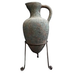 Elongated Terra Cotta Vase on Metal Stand