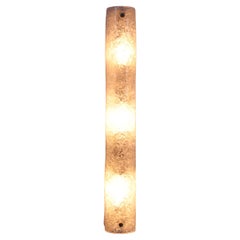 Elongated wall lamp by Honsel Leuchten with bubble glass 50 cm long.