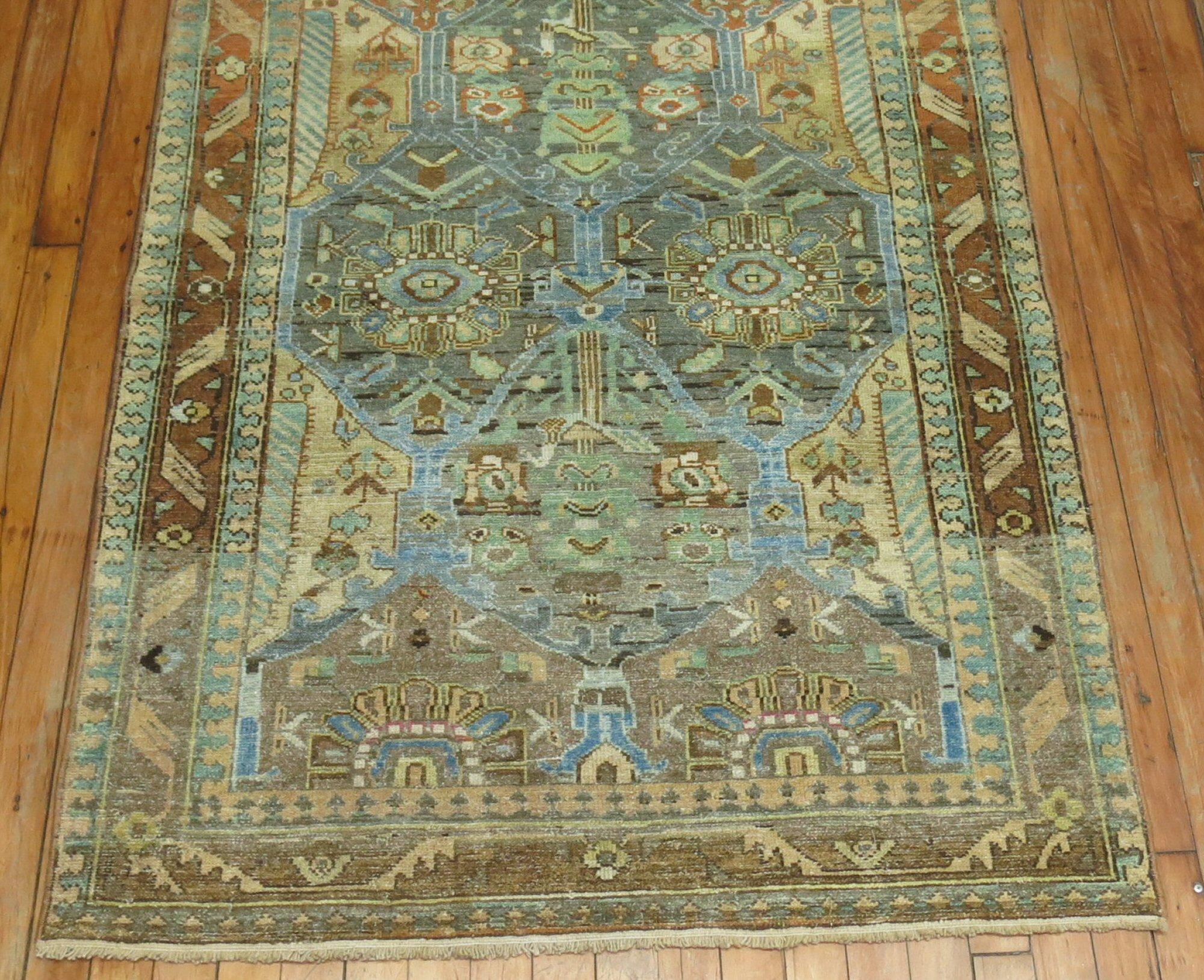 A throw size 20th century Persian Malayer rug with an all-over design in gray, light blue and green with a rusty orange border

Measures: 3'6” x 5'.