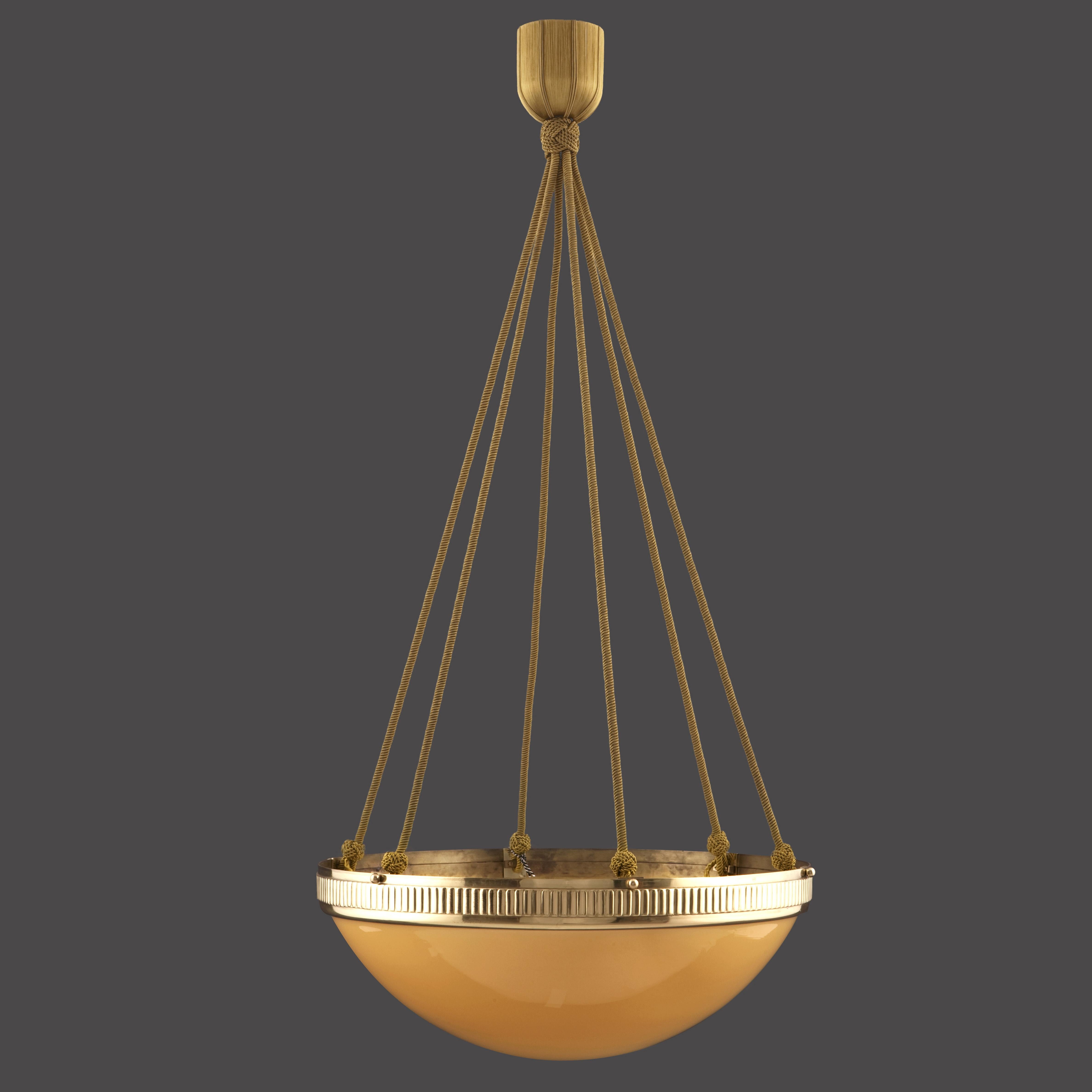 Chandelier with a colored opaline-glass in a handcrafted brass-rim, hanging on works of passementery

Total drop custom

Most components according to the UL regulations, with an additional charge we will UL-list and label our fixtures.