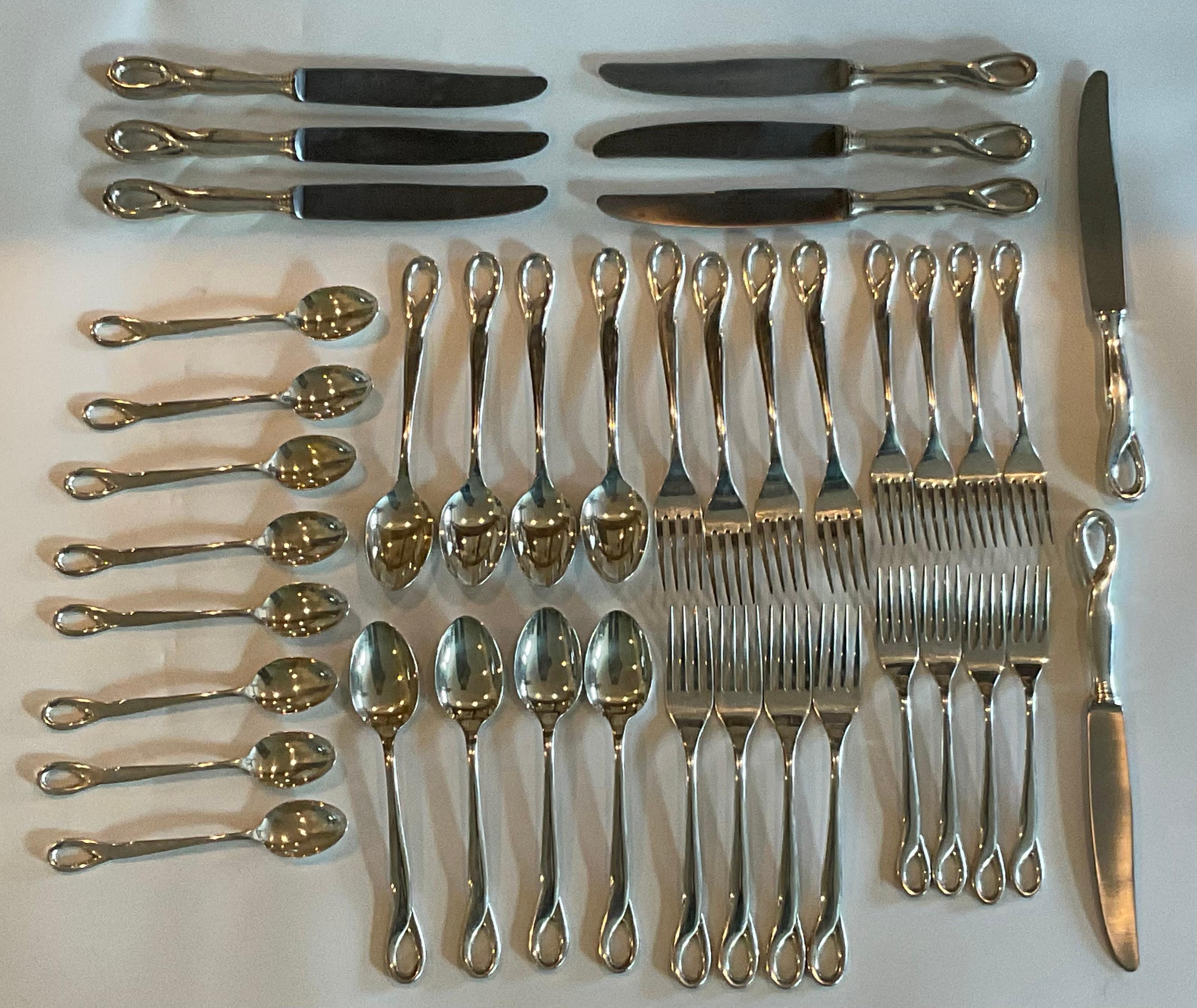 Elsa Peretti 40 Piece Tiffany and Company Padova Sterling Silver Flatware Set. Each piece signed and hallmarked. 16 Spoons, 16 Forks, and 8 knives. Larger fork weight 2.5 ounces (71 grams). Smaller fork 1.9 ounces (54 grams). Large spoon 2.8 ounces