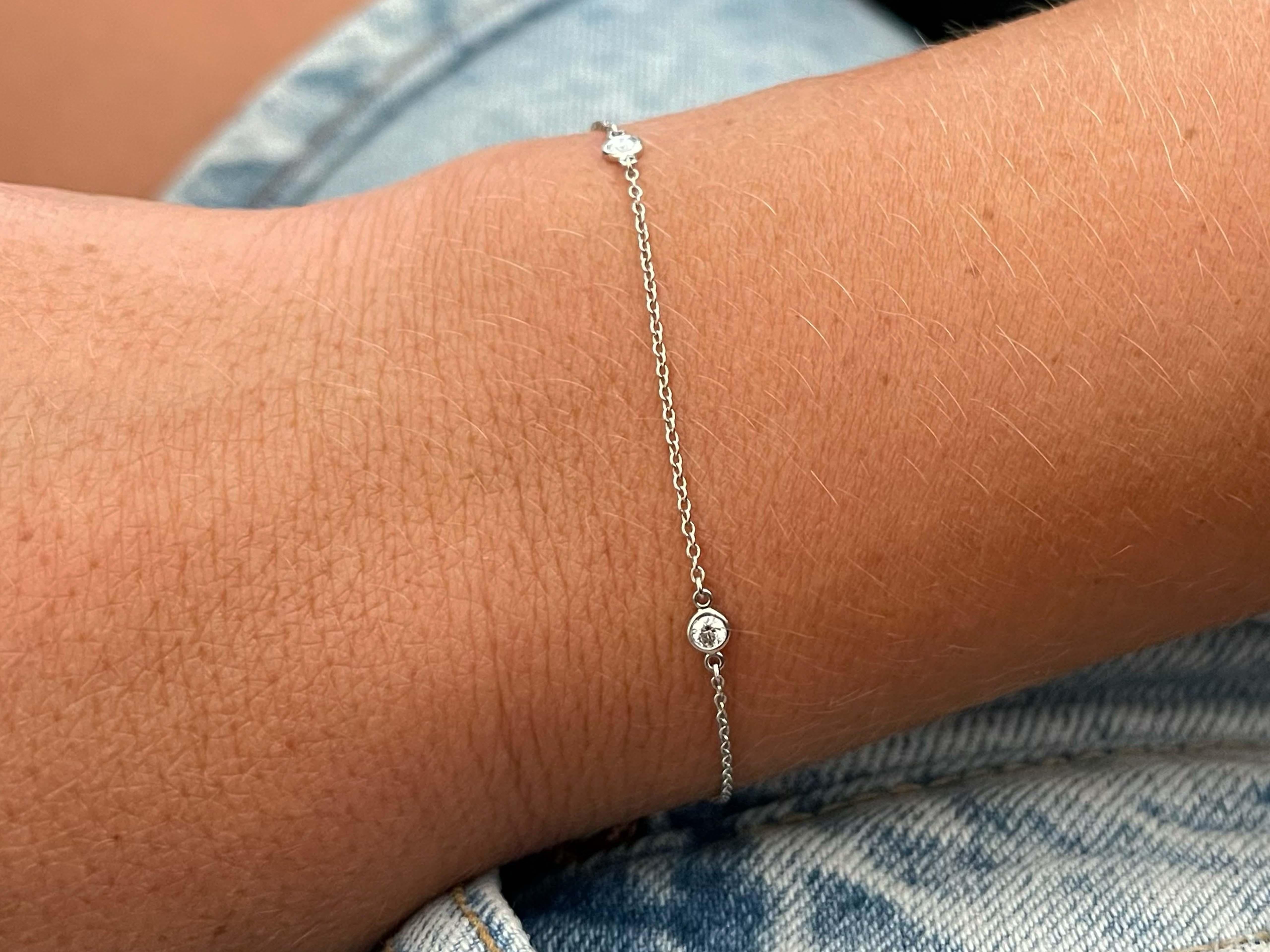 This beautiful diamond studded bracelet has 3 brilliant cut bezel set round diamonds. The diamonds on the pendant are F-G color, VS clarity and weight 0.15 carats. This bracelet is crafted in platinum 950. Fits a wrist size up to 6 inches.