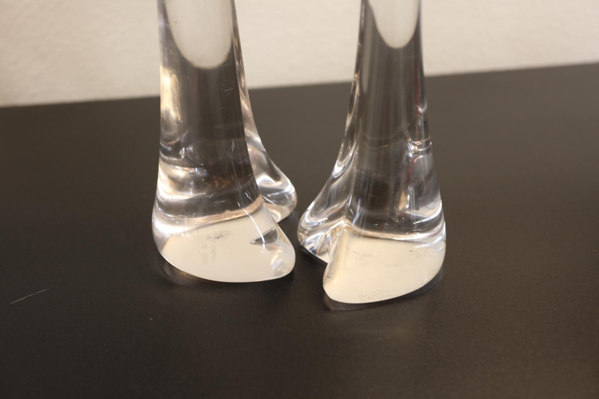 Lovely pair of bones glass Candlesticks by Elsa Peretti for Tiffany and Co. These are the largest size made. Both are signed on the base. These are hand made and not entirely the same, their shape is slightly different. In good condition, with no