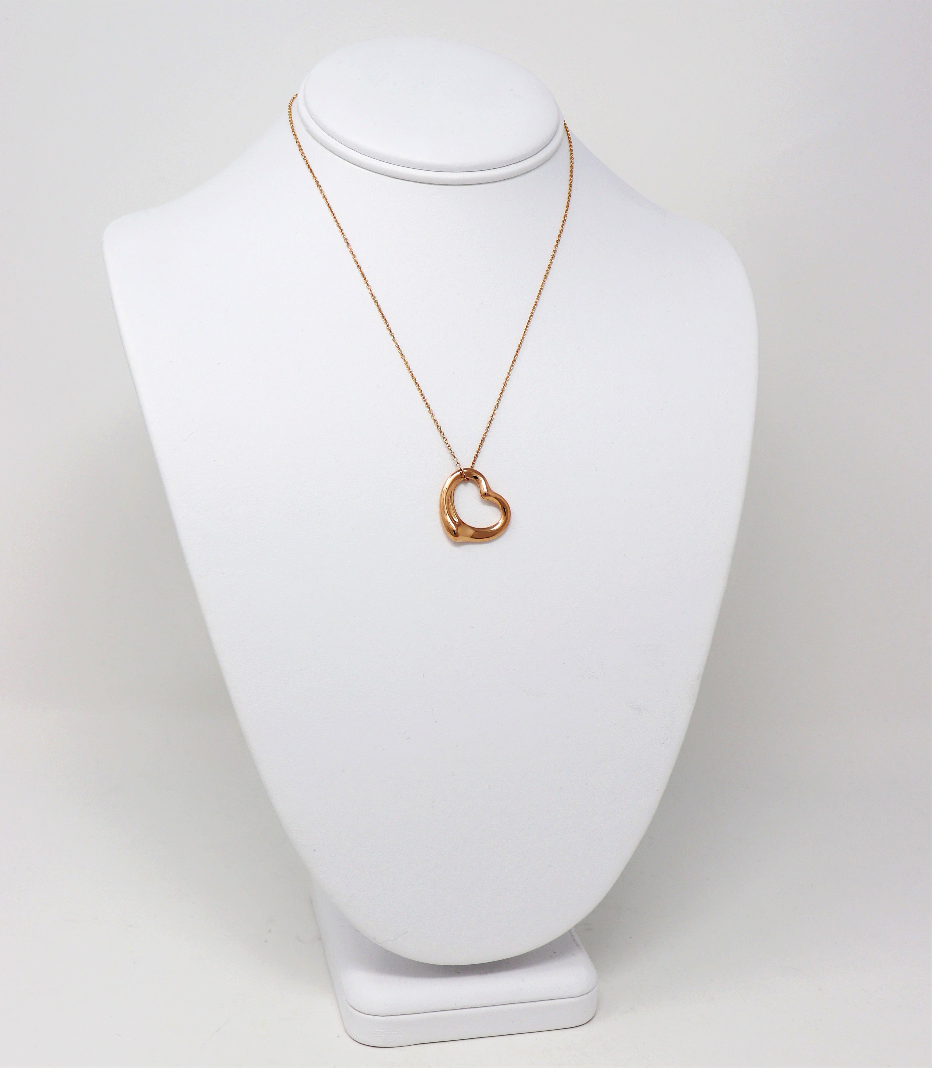 Gorgeous open heart pendant necklace by Elsa Peretti for Tiffany & Co. exudes minimalist elegance. The timeless design combined with the warm rose gold setting makes for a piece that you will admire for years to come. 

This beautiful designer
