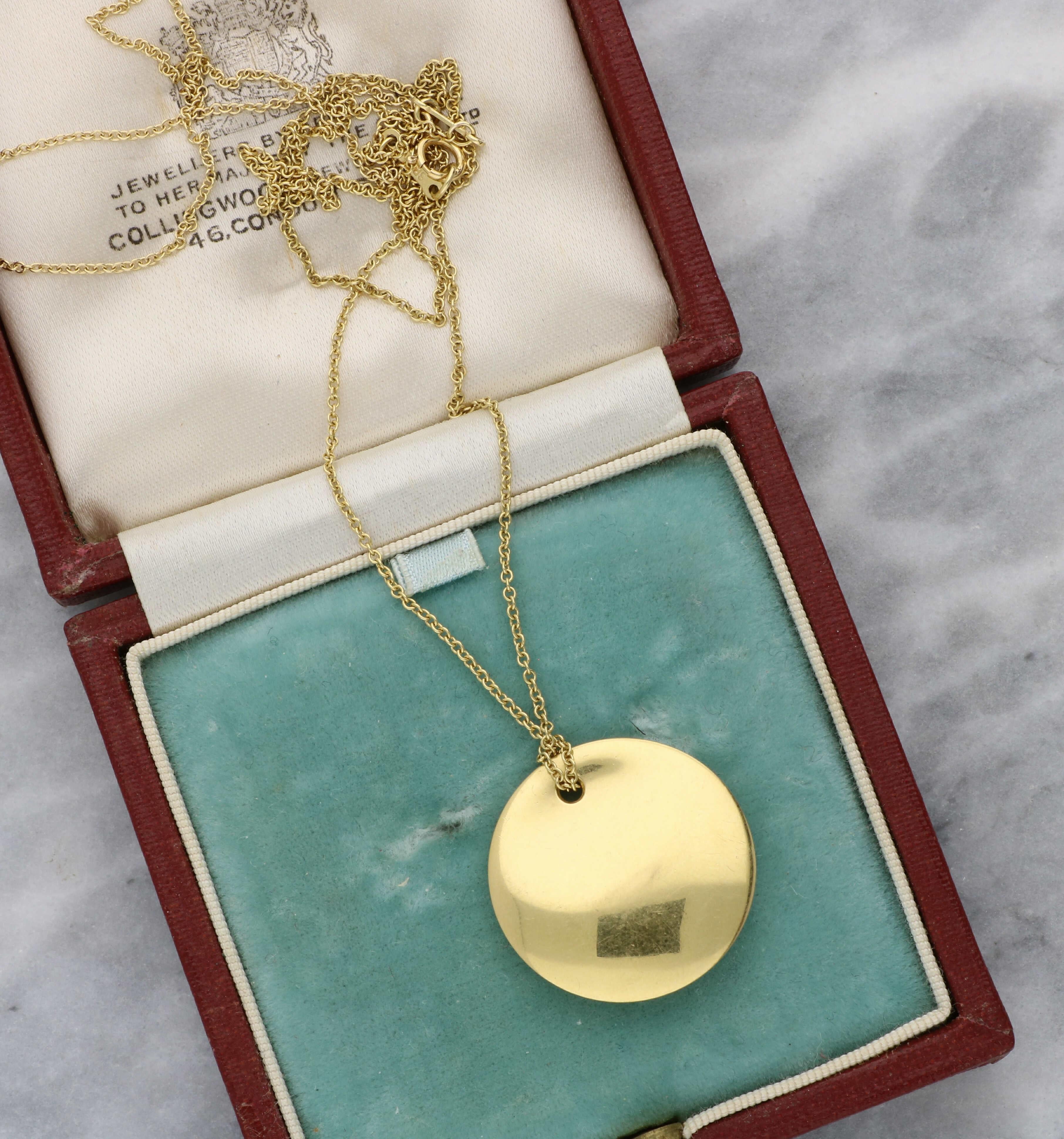 A lovely 18ct yellow gold Tiffany & Co pendant necklace by Elsa Peretti. The pendant measures 22.5mm round and 4mm wide. The chain measures 23 inches and the total weight of the chain and pendant is 7.4 grams. 

At Wave Antiques we donate 1% of all