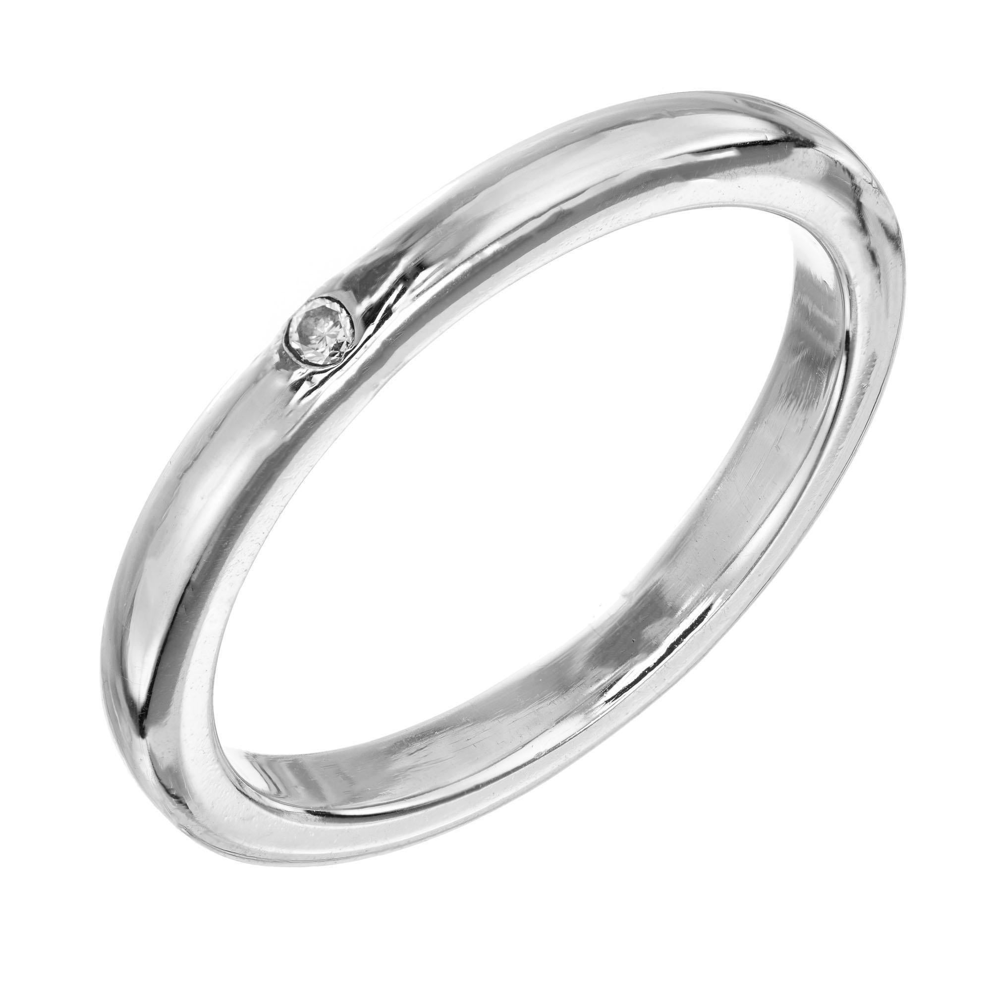 Platinum band ring with a round brilliant cut diamond design by Elsa Peretti for Tiffany & Co.

1 round brilliant cut diamond, G-H VS approx. .02cts
Size 5.5 and sizable.
Platinum 
Stamped: PT 950
Hallmark: Tiffany & Co Peretti 
5.2 grams
Width at