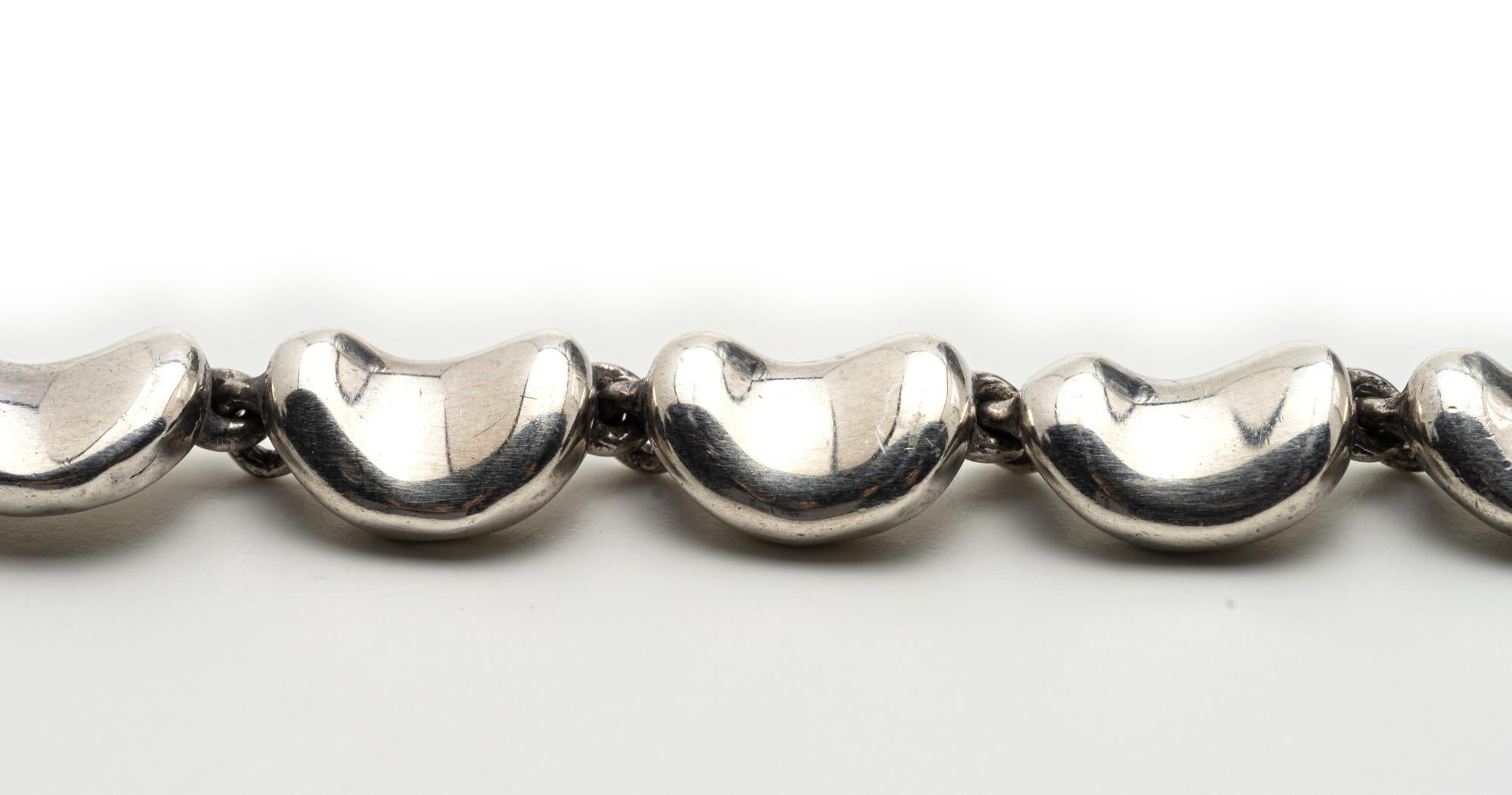 Elsa Peretti for Tiffany & Co.
A sterling silver bracelet, designed as a series of undulating silver links, total gross weight approximately 21.7 grams, length 6 1/4 inches, signed Tiffany & Co. Peretti