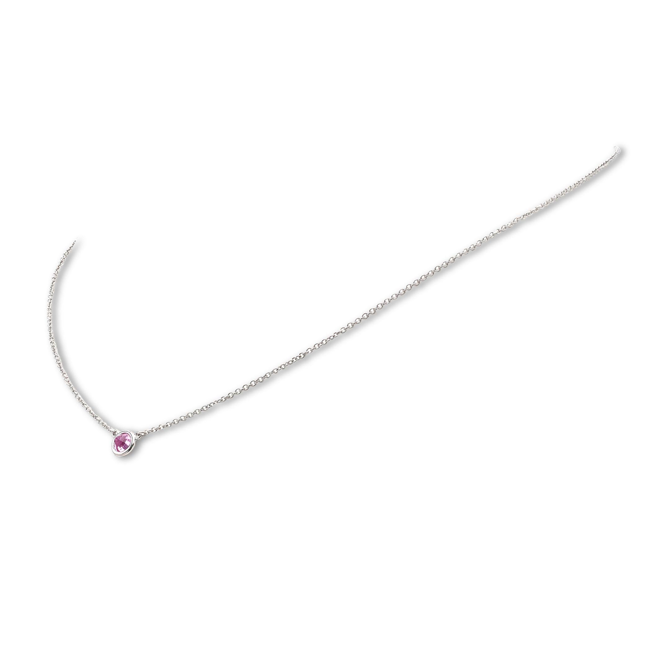Authentic Elsa Peretti for Tiffany & Co. 'Color by the Yard' necklace crafted in platinum and featuring a single round brilliant cut pink sapphire. The chain measures 16 1/2 inches in length. Signed Elsa Peretti, Tiffany & Co., PT950. Necklace is