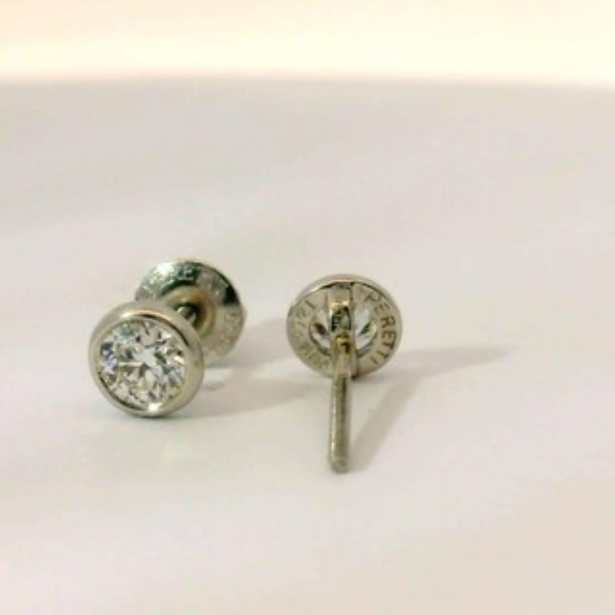 These stunning diamond studs were designed for Tiffany & Co by Elsa Peretti.  The round diamonds are approximately .66ctw.  The earrings are bezel set in platinum with threaded posts.  The diamonds are VS clarity and F/G color.