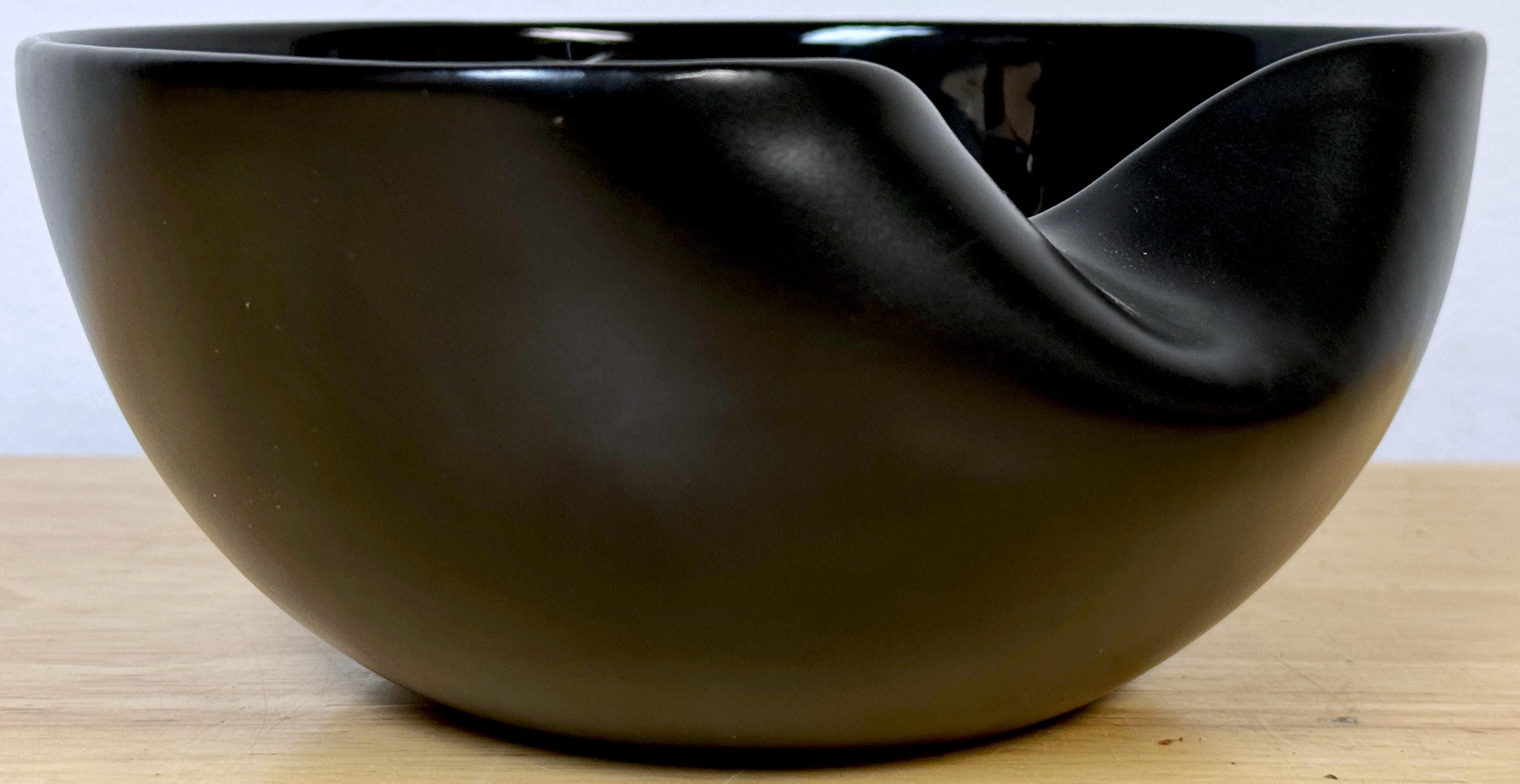 Elsa Peretti for Tiffany & Co. Glazed & Unglazed Black Bowl, C. 1990s

A rare and unique version of the iconic 'Thumbprint' design by Elsa Peretti, an earlier work, this version is a tour de force in ceramics; the outside is glazed with a high gloss