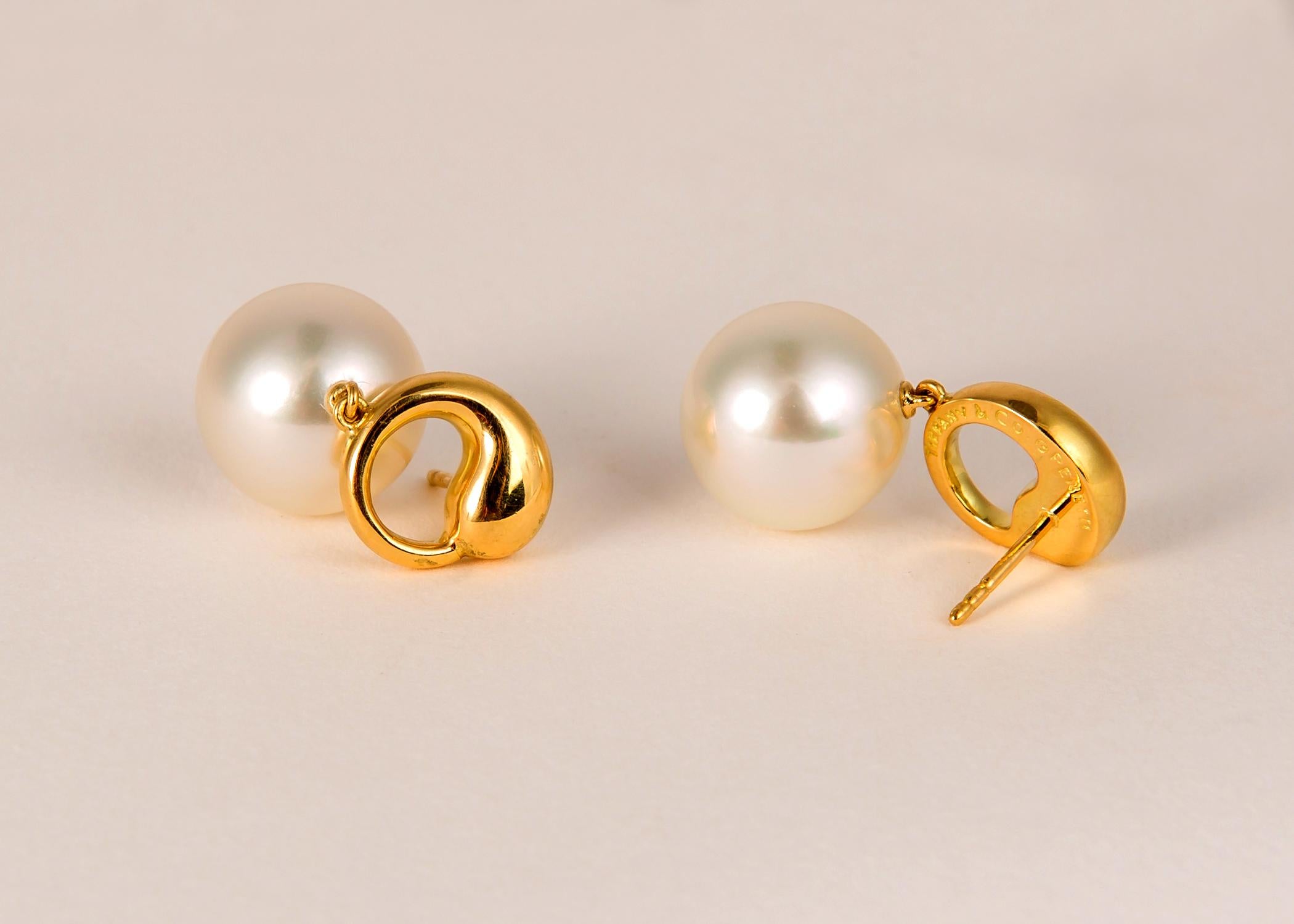 Elsa Peretti began her career with Tiffany & Co. in 1974. Her soft organic designs are like no other and have become classic. Her eternity circle and South Sea pearls is rarely available. The 12.9 mm pearls are perfectly matched gem quality.  1 inch