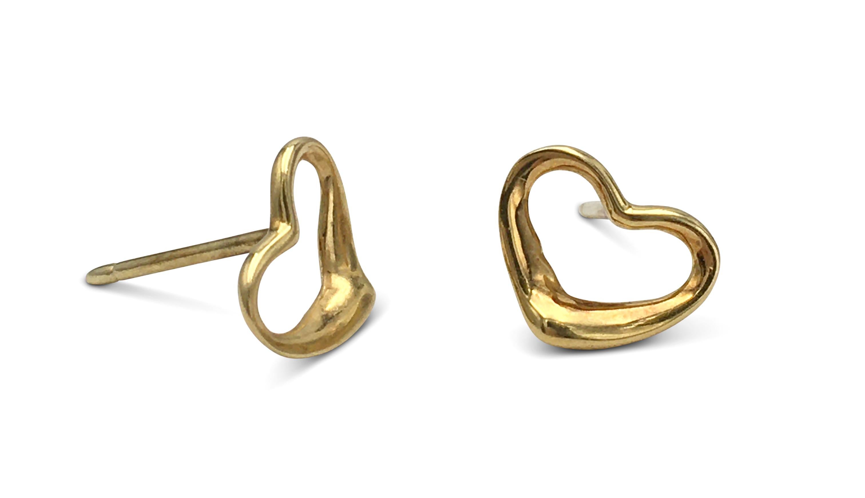 Authentic Elsa Peretti for Tiffany & Co. open heart earrings crafted in 18 karat yellow gold. Signed T&Co., Peretti, 18K. The earrings are presented with the original box, no papers. CIRCA 2000s.