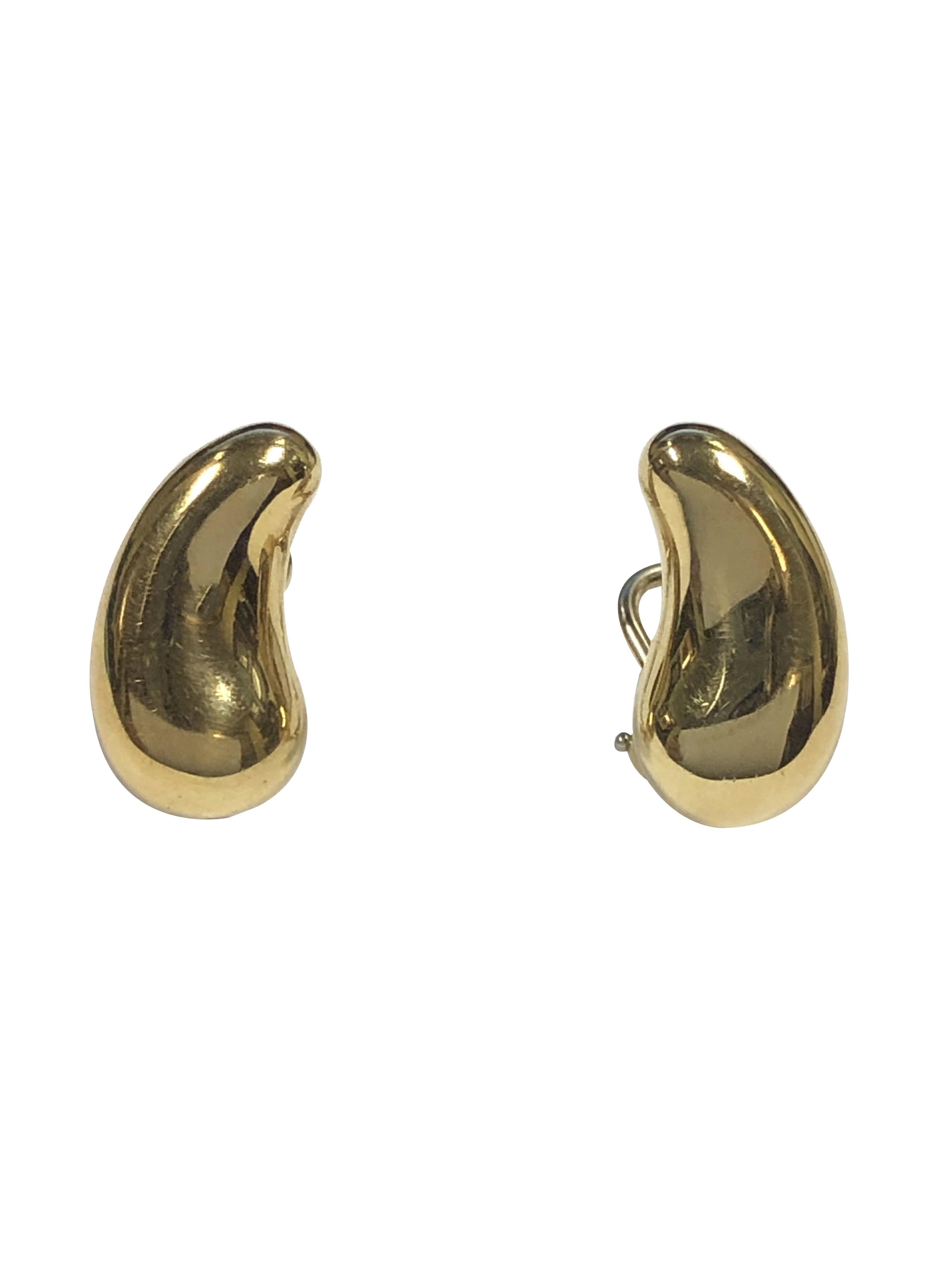 Circa 1980 Elsa Peretti for Tiffany & Company 18k Yellow Gold Bean Earrings, measuring 5/8 X 3/8 inch and weighing 8.8 Grams. Having Omega clip backs to which a post can be easily added if desired. 