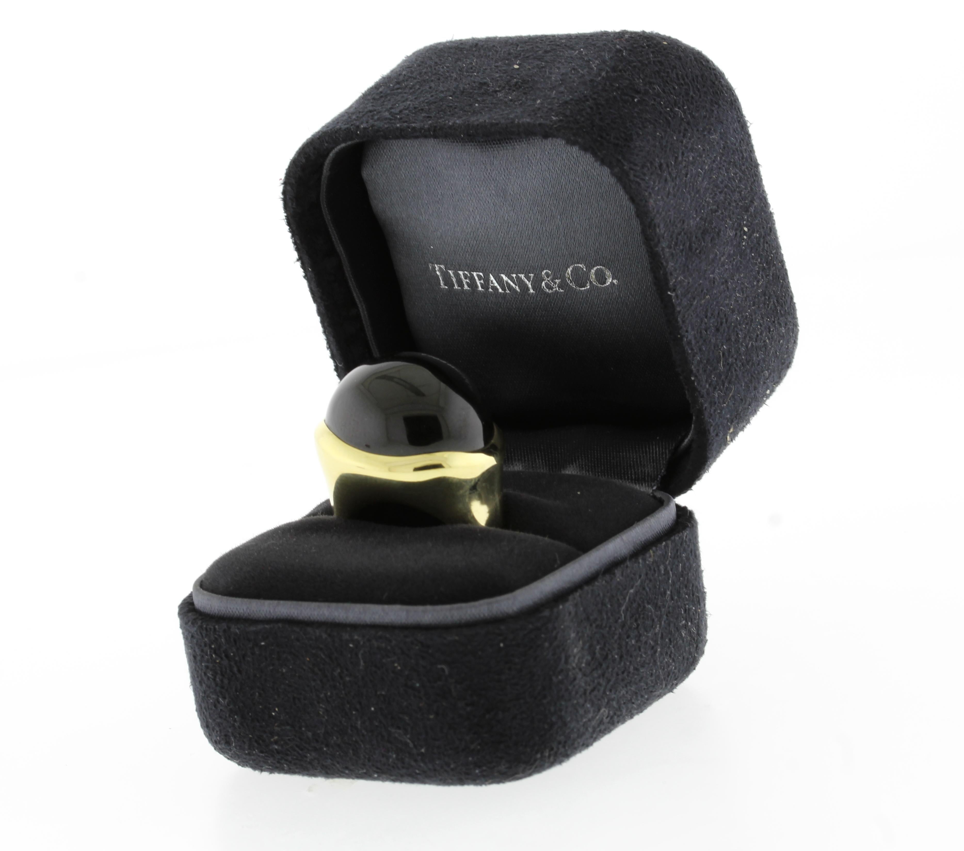 From  Tiffany & Co designer Elsa Peretti  this wonderful cabochon black Jade dome ring.

♦ Designer:  Elsa Peretti  for Tiffany & Co
♦ Metal: 18 karat
♦ Jade  18mm x 20mm.
♦ size 6½
♦ Circa 2015
♦ Packaging: Tiffany box 
♦ Condition: Excellent as