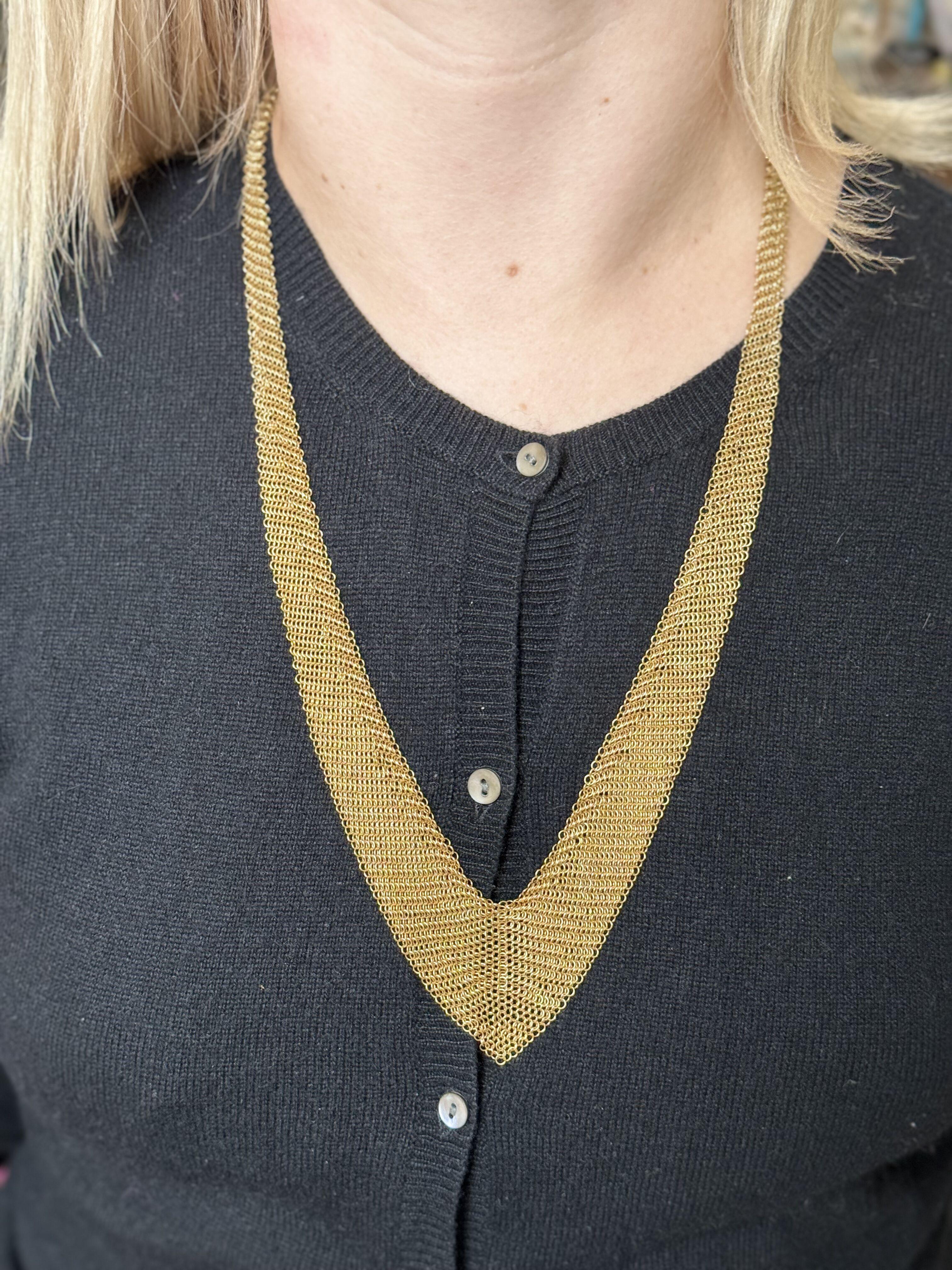 Iconic mesh scarf necklace, designed and created by Elsa Peretti for Tiffany & Co, in 18k yellow gold. Necklace is 27