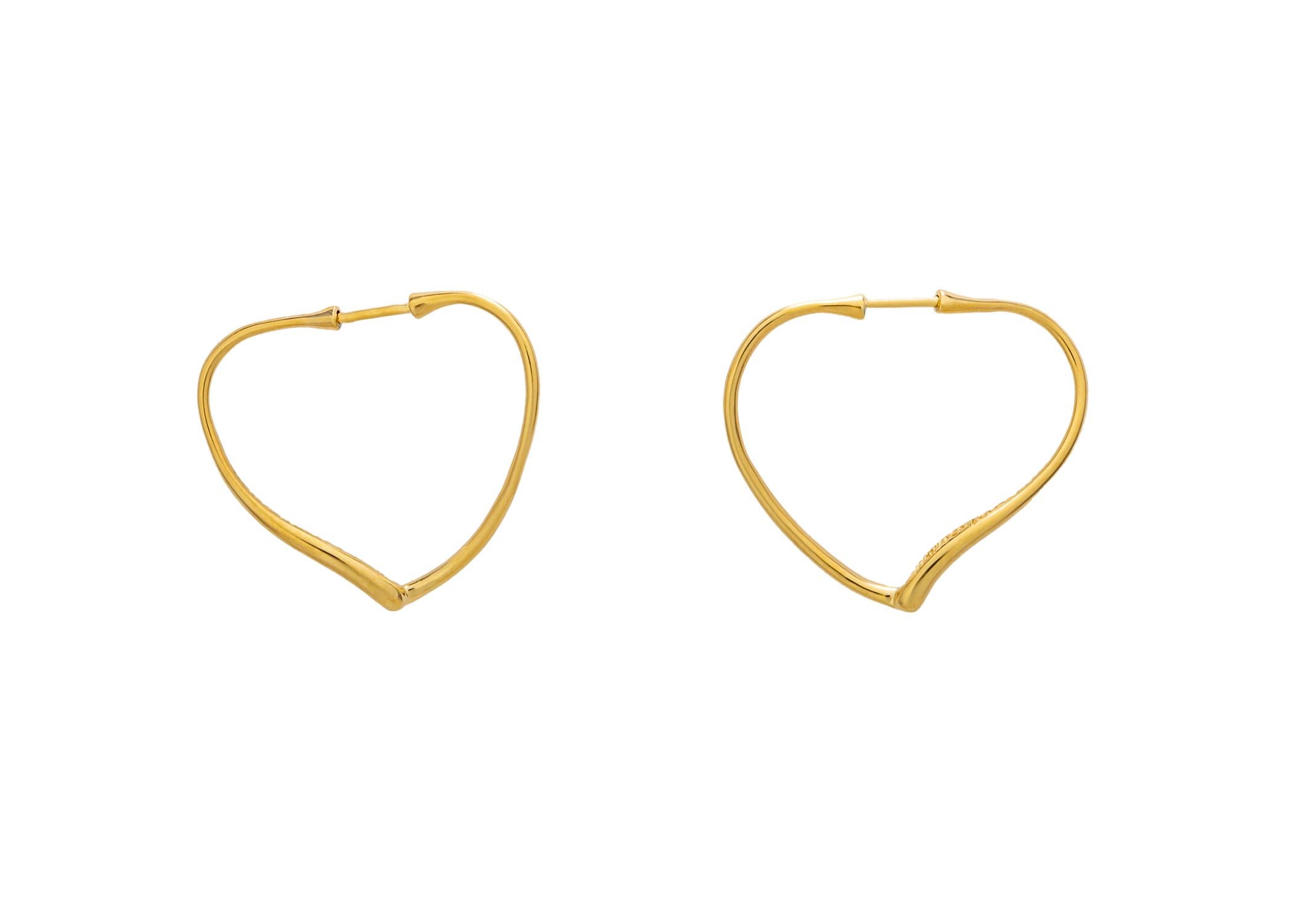 Elsa Peretti makes a simple hoop earring unique and interesting. Her freeform heart design is a wearable addition to any jewelry wardrobe. 1 1/4 x 1 1/8 inches in size. 