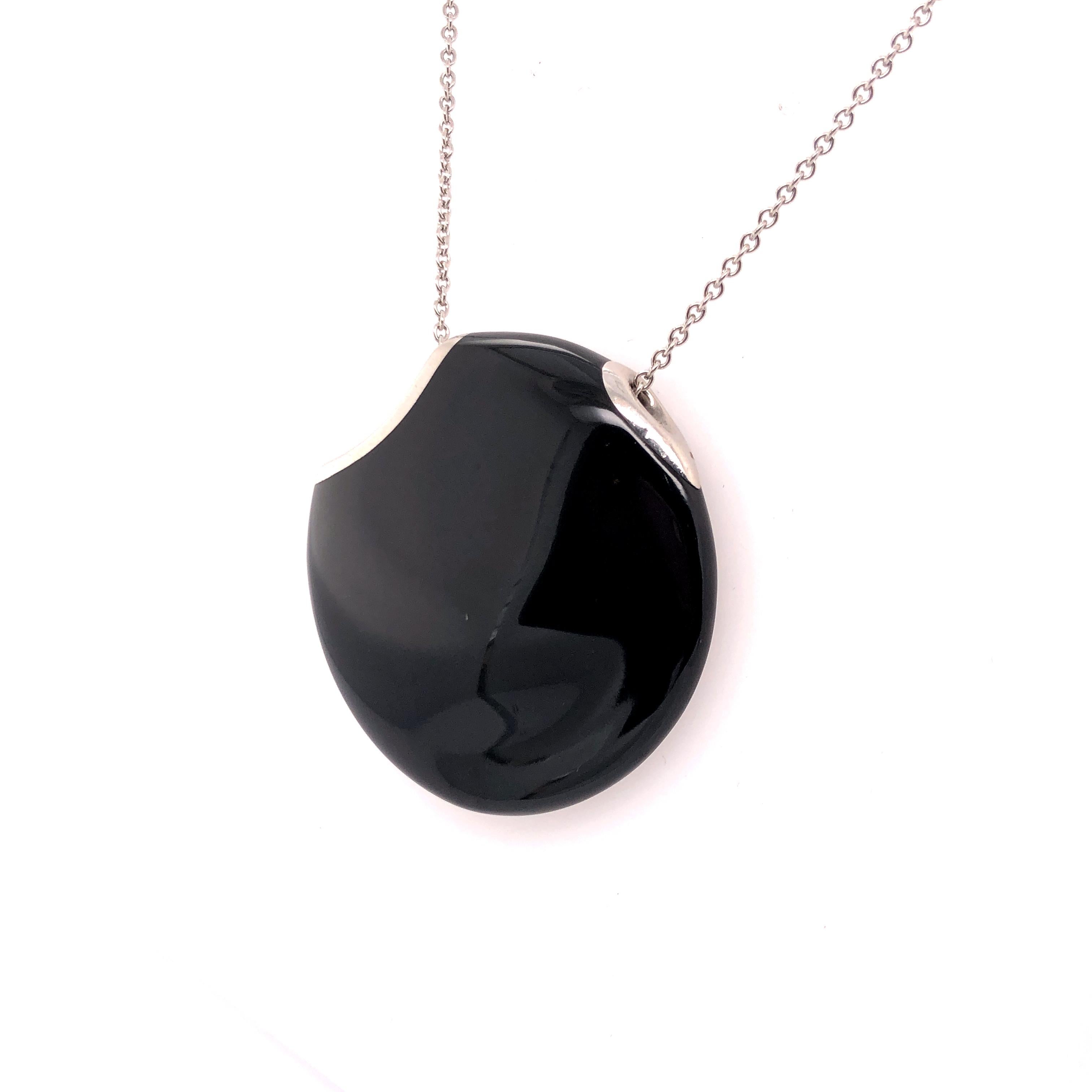 Elsa Peretti's platinum black enamel that she designed for Tiffany & Co. is a wonderful every day necklace. Easily transition from work to a night on the town. 

The irregular pendant sits on a 28