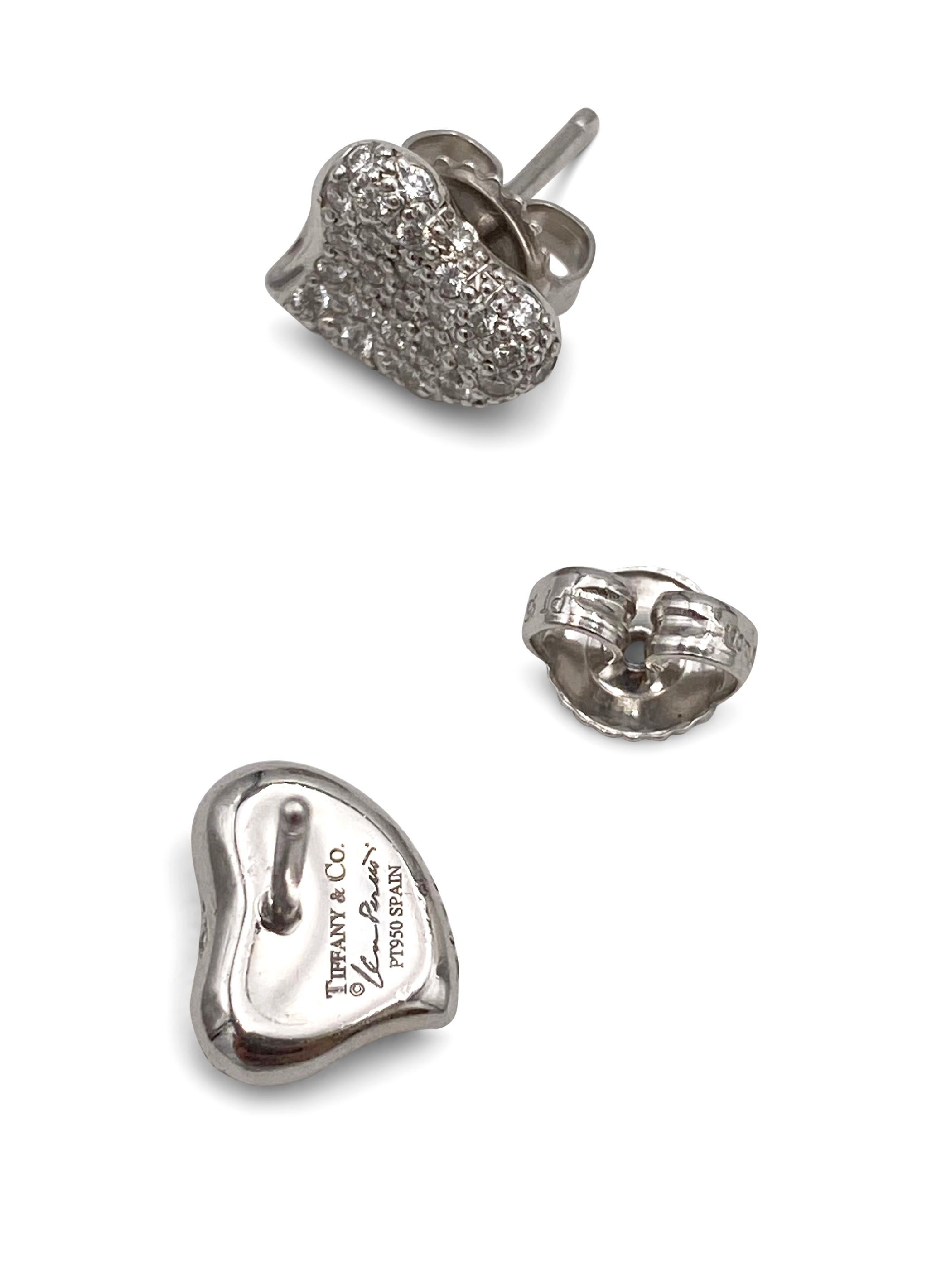 Authentic Elsa Peretti for Tiffany & Co. 'full heart' earrings crafted in platinum and pave set with an estimated 0.70 carats of round brilliant cut diamonds (E-F color, VS clarity). Signed Tiffany & Co., Elsa Peretti, PT950, Spain. The earrings are