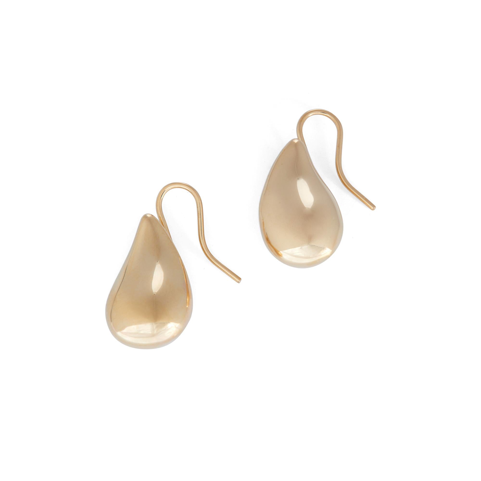Authentic Elsa Peretti for Tiffany & Co. Teardrop earrings crafted in 18 karat high polished gold.  The teardrops measure 3/4 inches in length with French wire backs.  Signed Tiffany & Co., Peretti, 750.  Earrings are presented with a tiffany pouch,